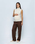 The Sleeveless Roll-Neck in Cream white, front view