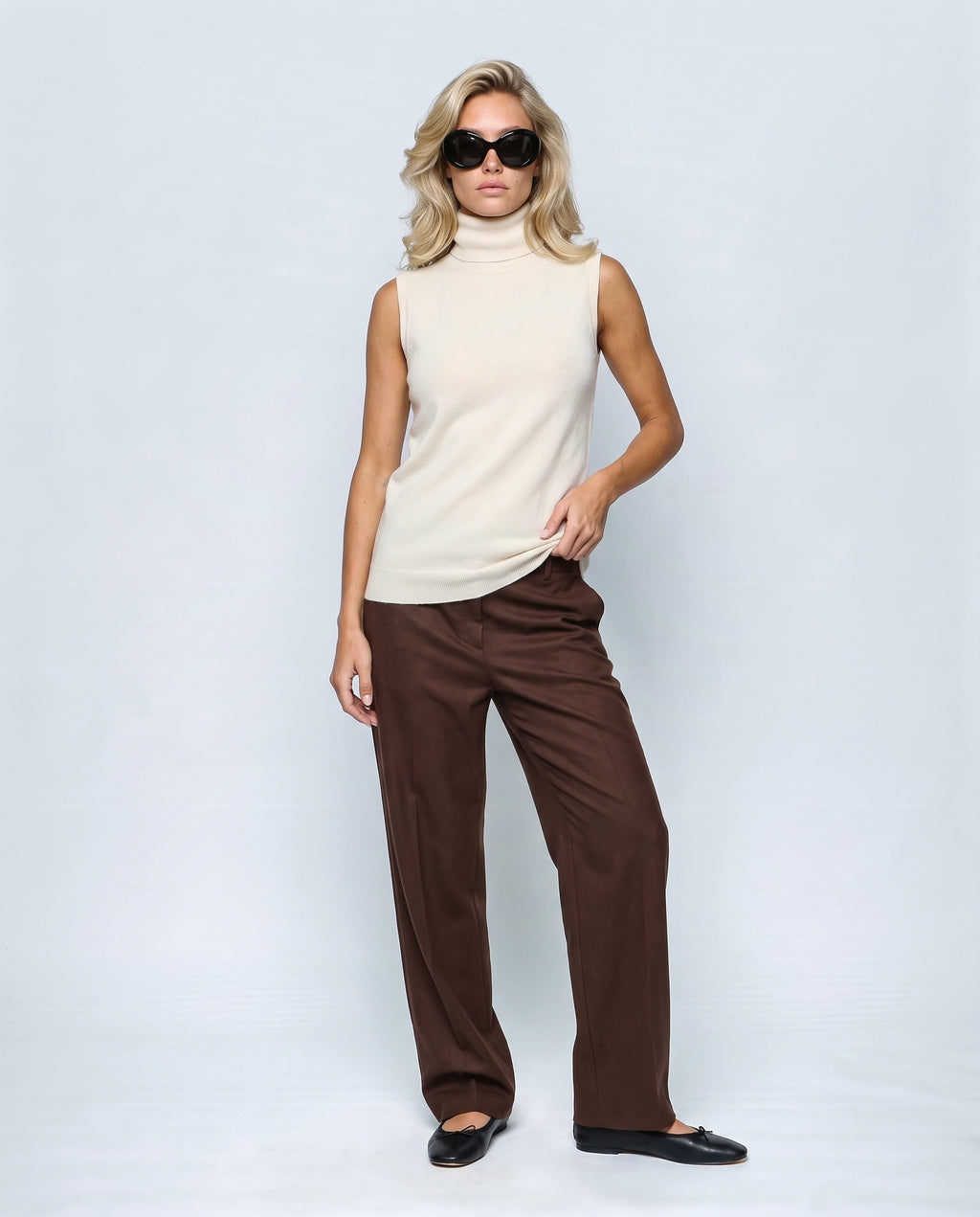 The Sleeveless Roll-Neck in Cream white, front view on a non-pregnant model