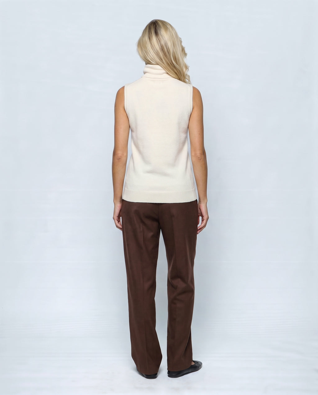 The Sleeveless Roll-Neck in Cream white, back view on a non-pregnant model
