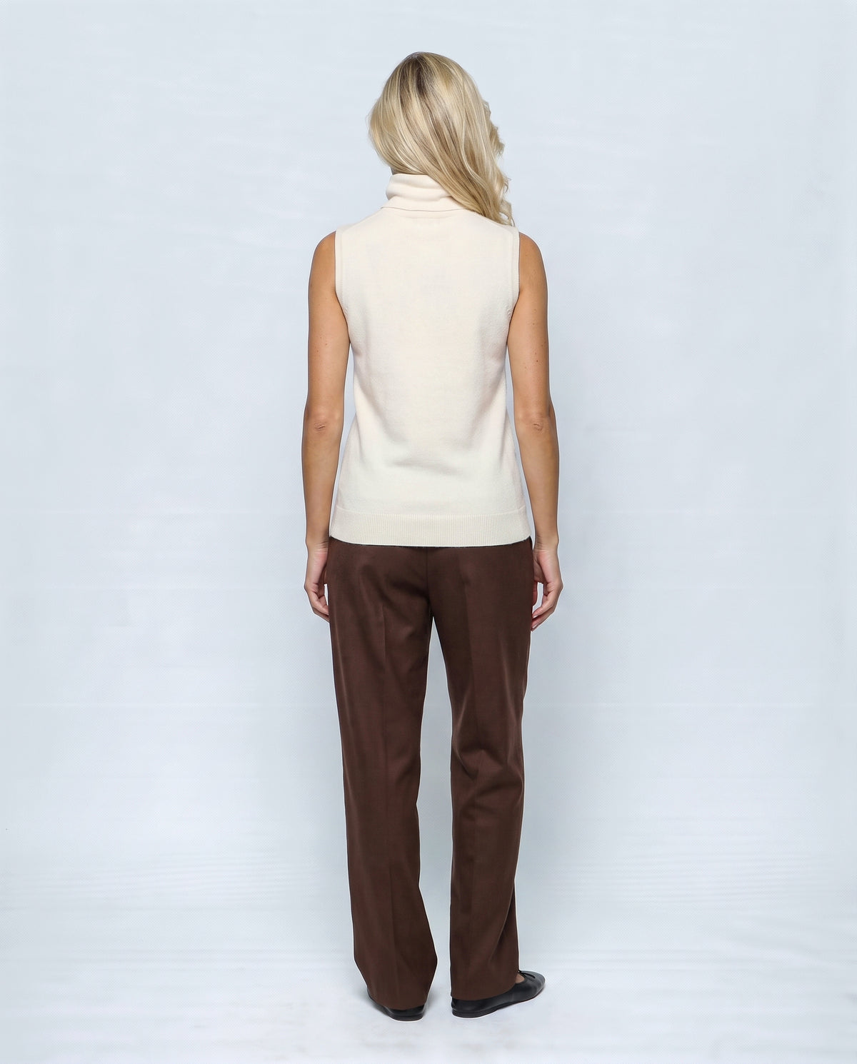 The Sleeveless Roll-Neck in Cream white, back view on a non-pregnant model