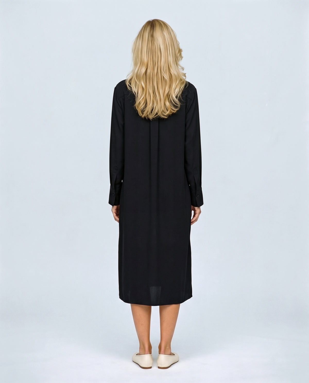 The Belted Utility Shirt Dress in Black, back view on a non-pregnant model