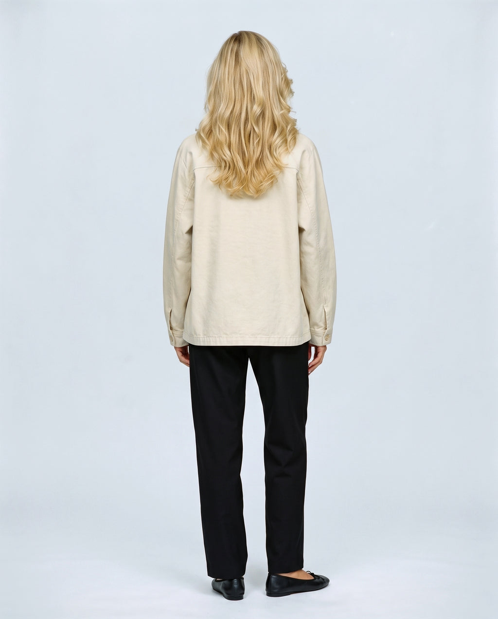 The Relaxed Utility Jacket in Beige, back view on a non-pregnant model