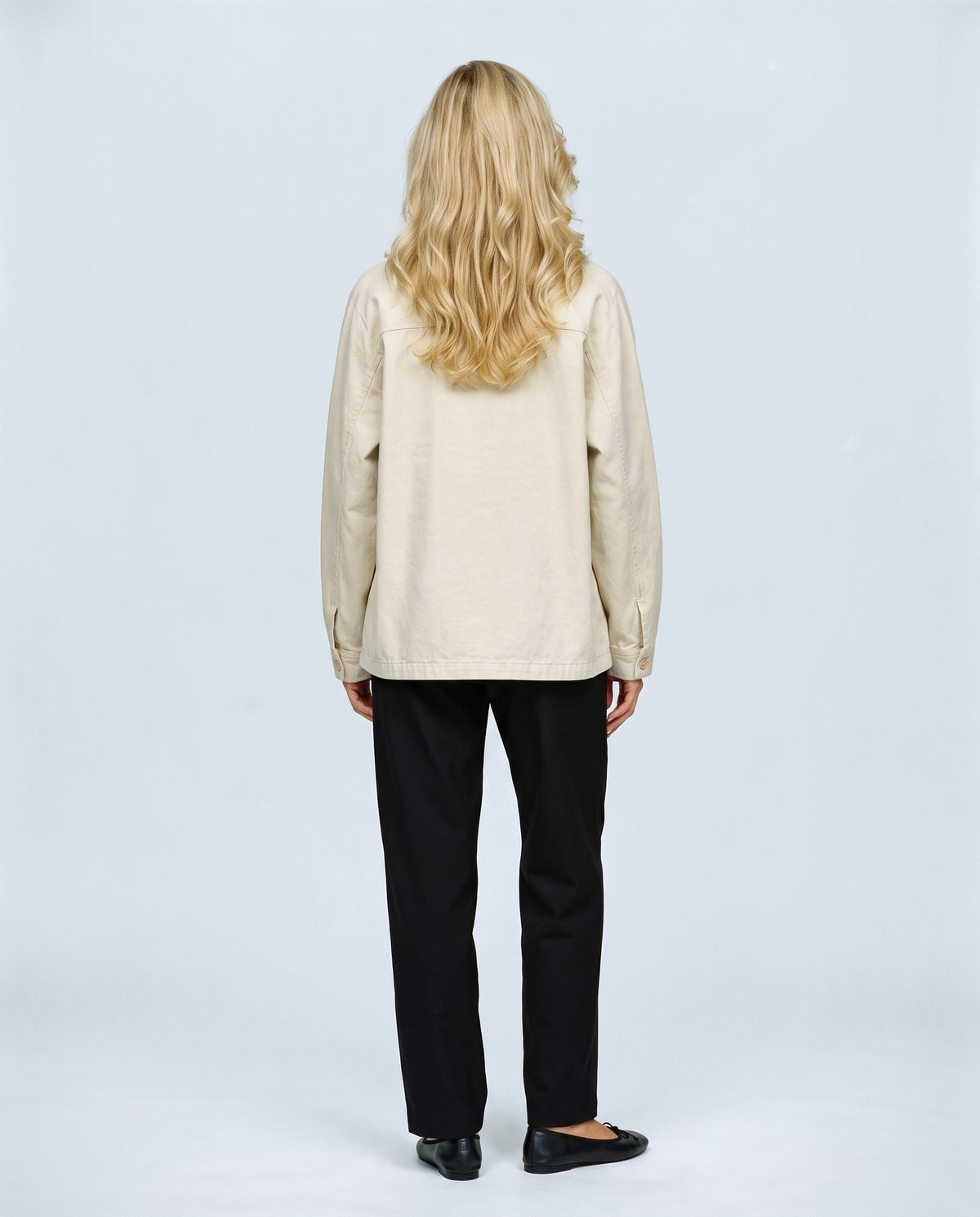 The Relaxed Utility Jacket in Beige, back view on a non-pregnant model