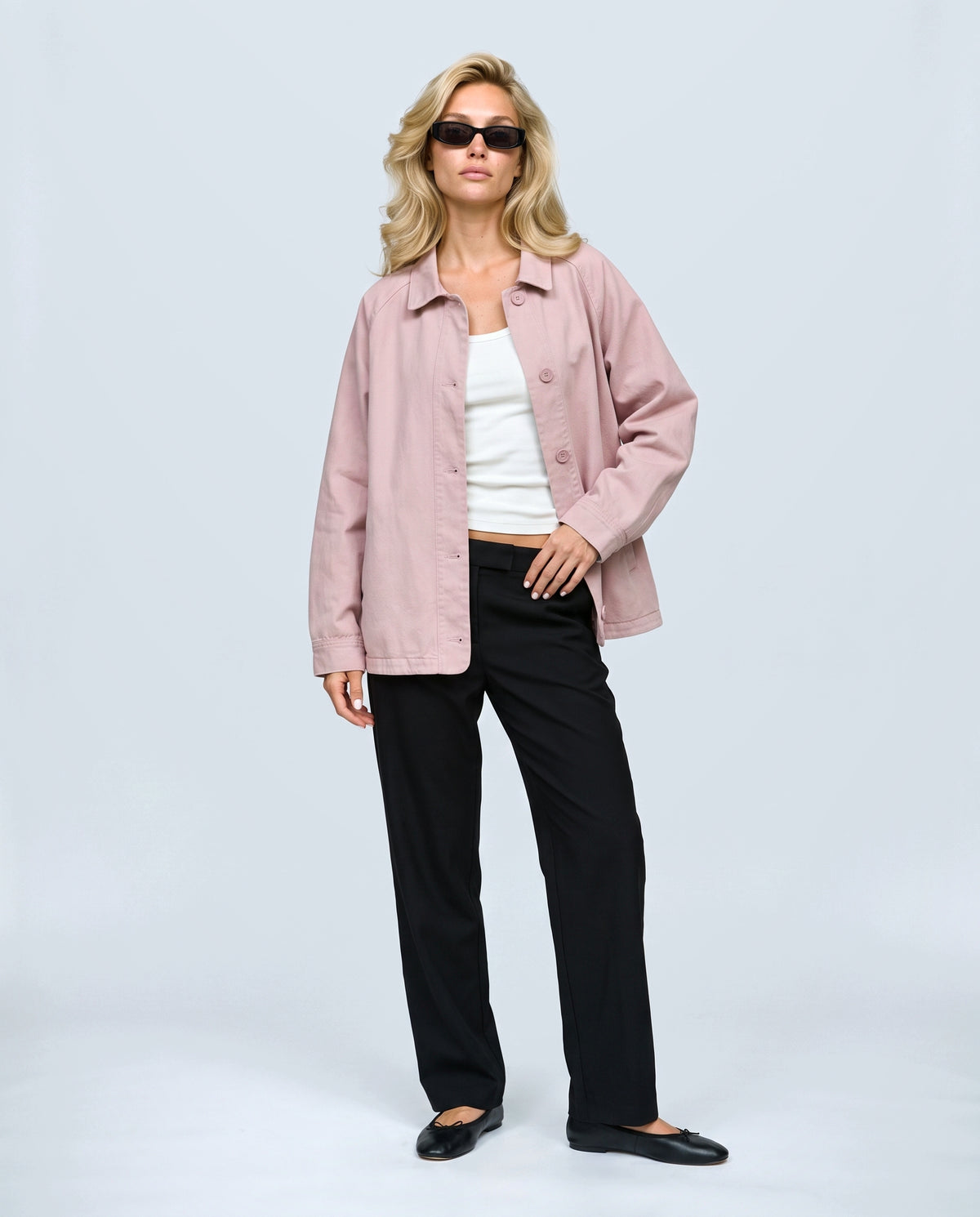 The Relaxed Utility Jacket in Light pink, front view on a non-pregnant model