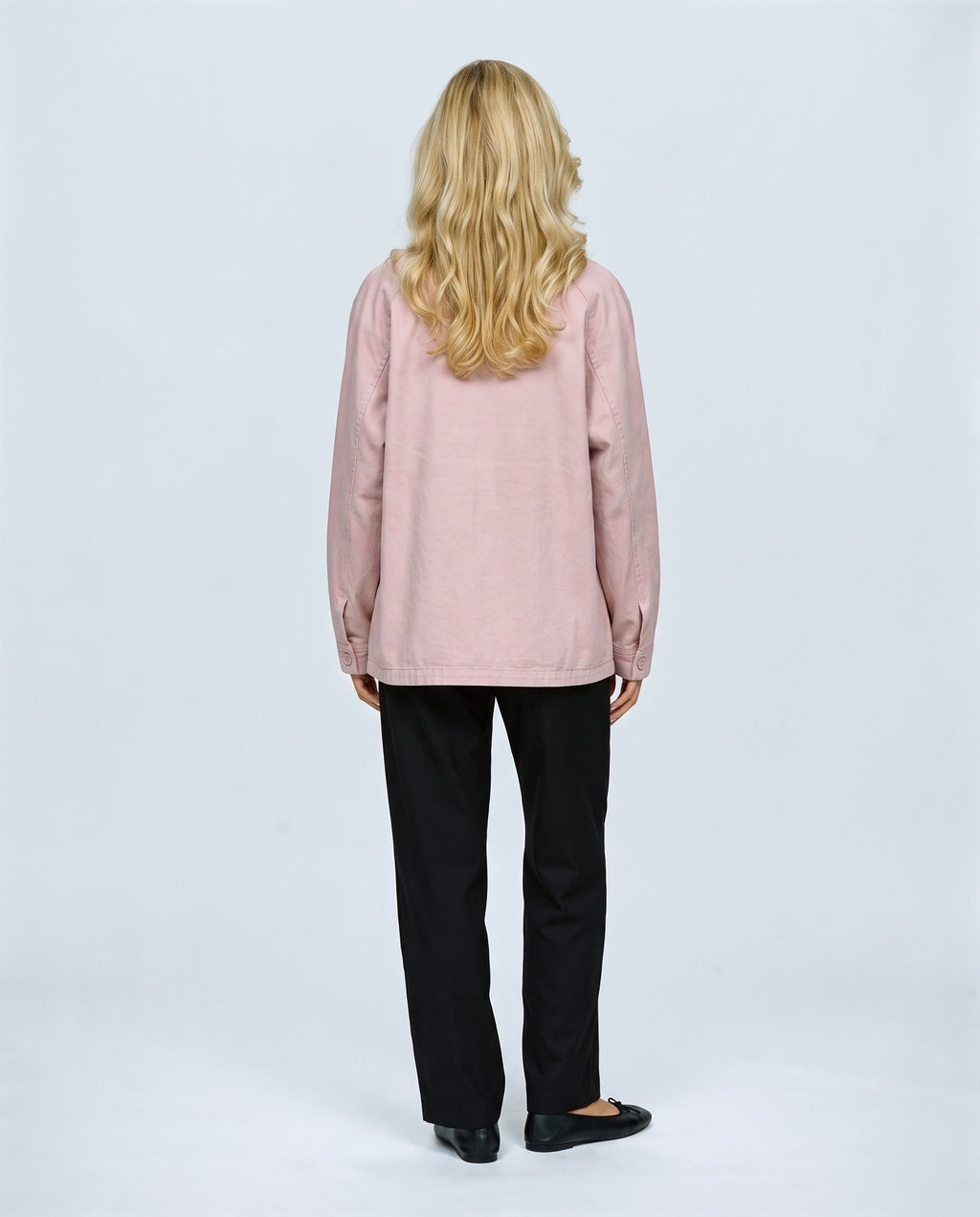 The Relaxed Utility Jacket in Light pink, back view on a non-pregnant model