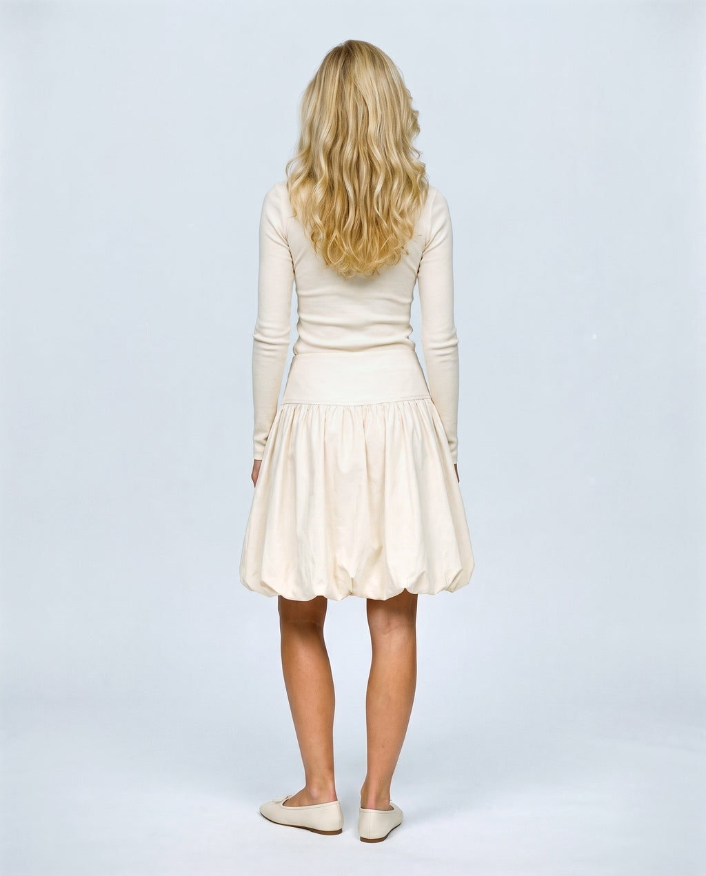 The Sculpted Tulip Skirt in Khaki, back view on a non-pregnant model