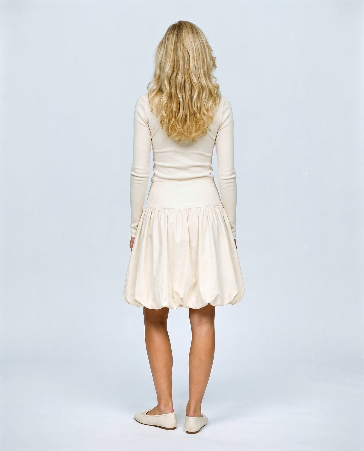 The Sculpted Tulip Skirt in Khaki, back view on a non-pregnant model