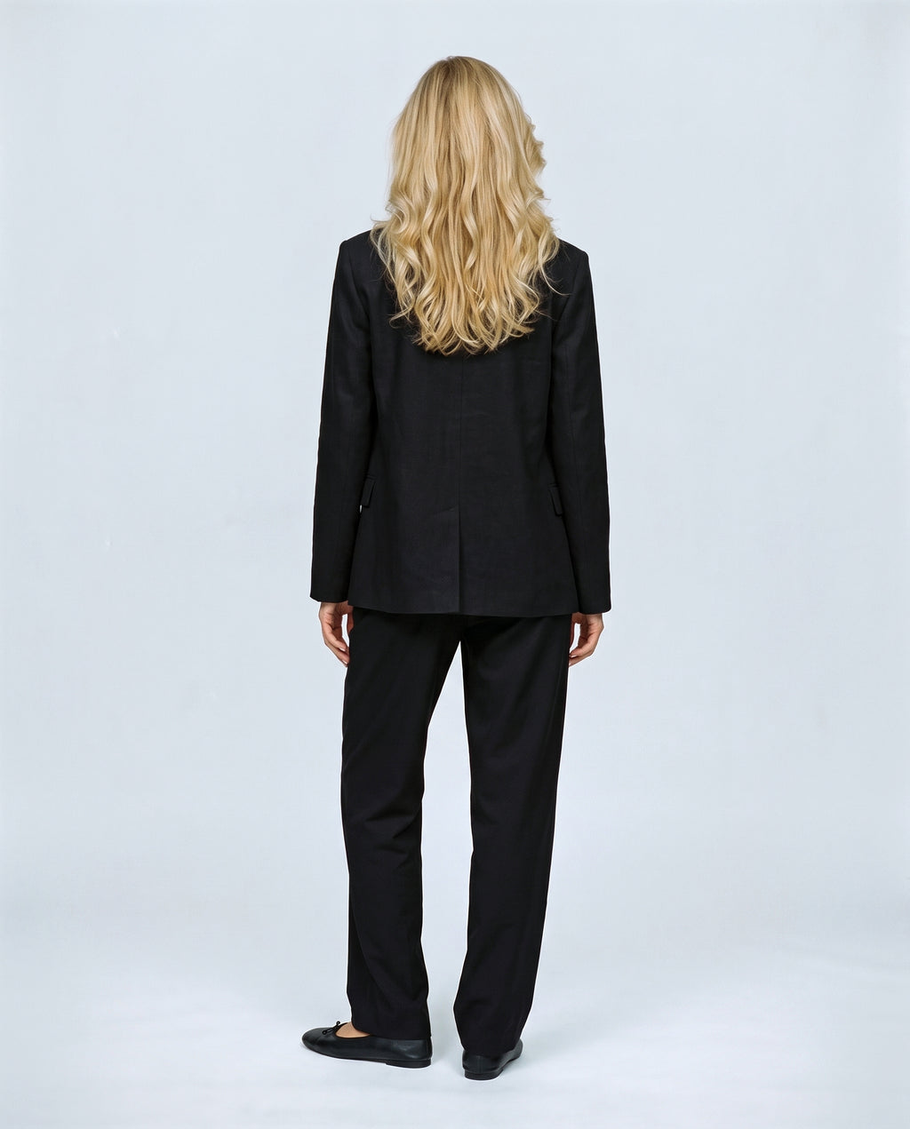 The Stand-Collar Checked Jacket in Black, back view on a non-pregnant model