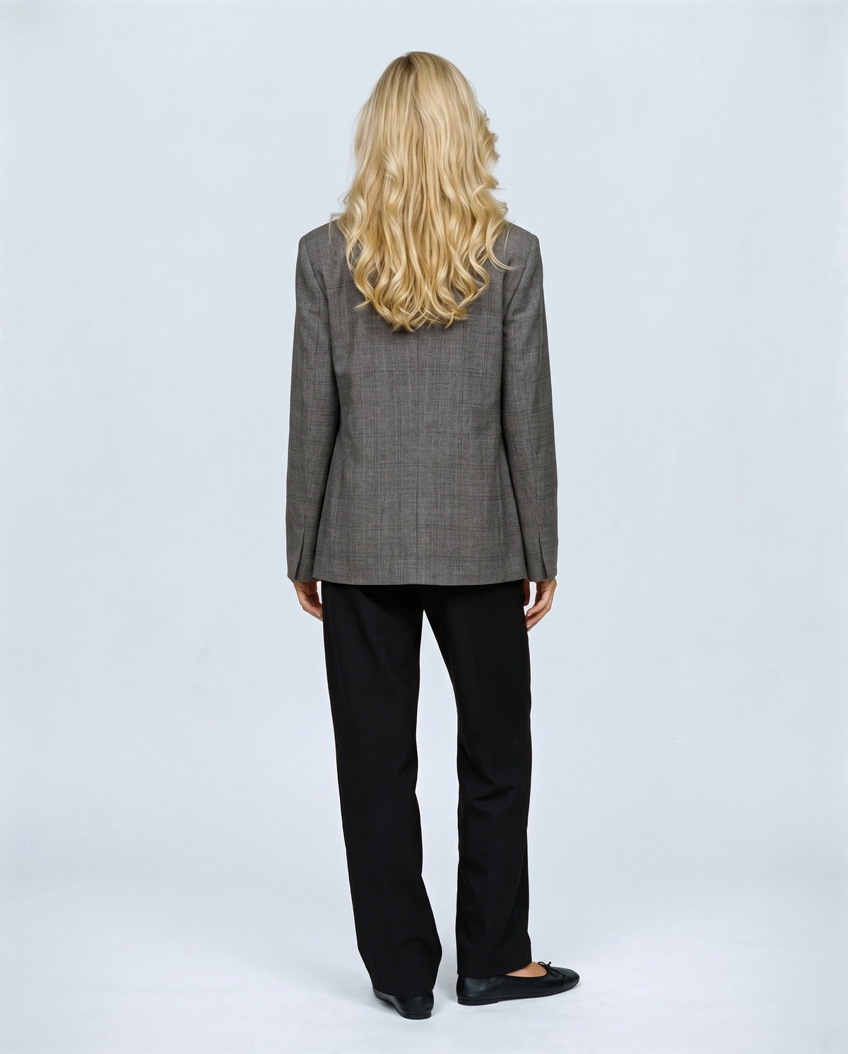 The Stand-Collar Checked Jacket in Grey check, back view on a non-pregnant model