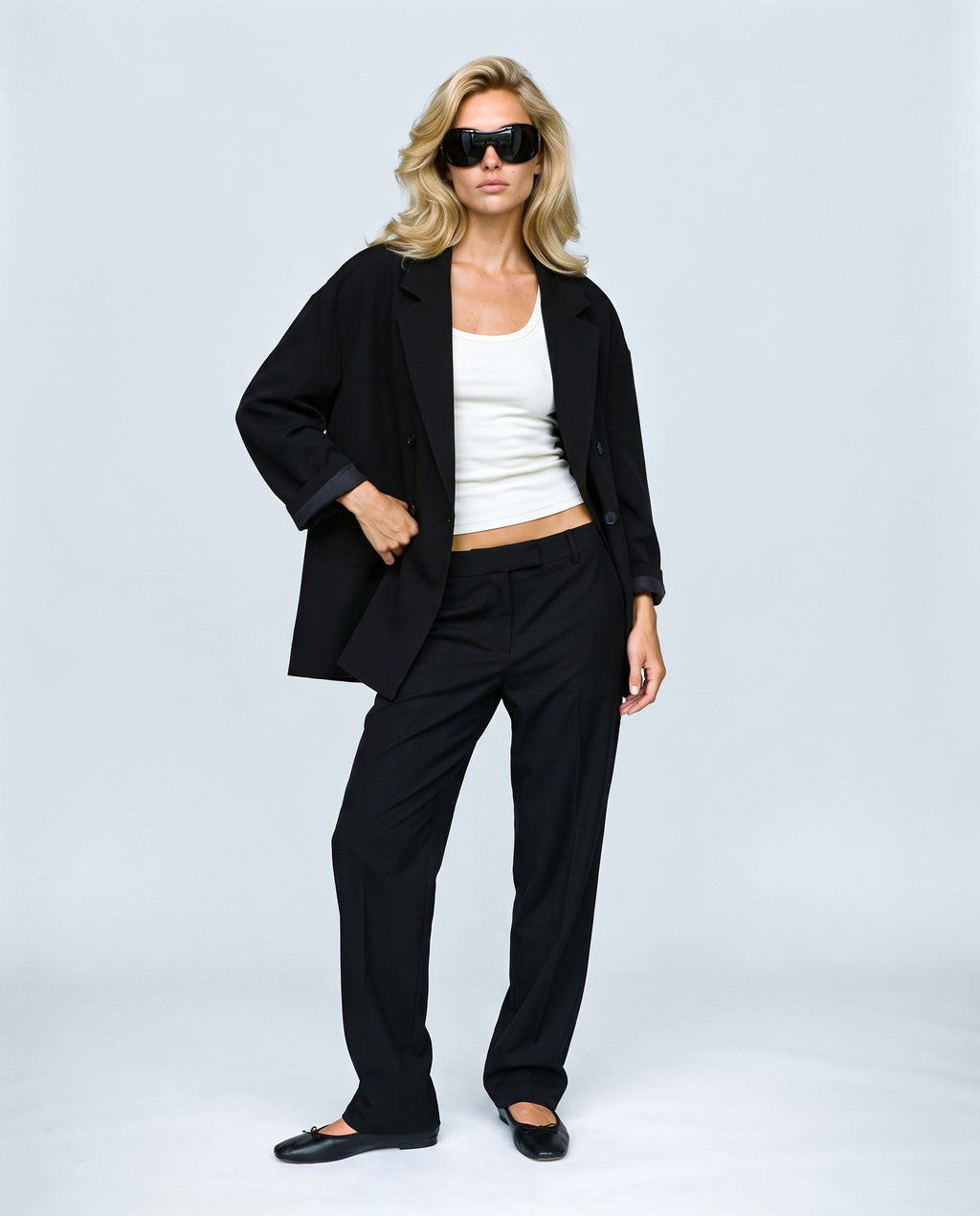 The Relaxed Double-Breasted Blazer in Black, front view on a non-pregnant model