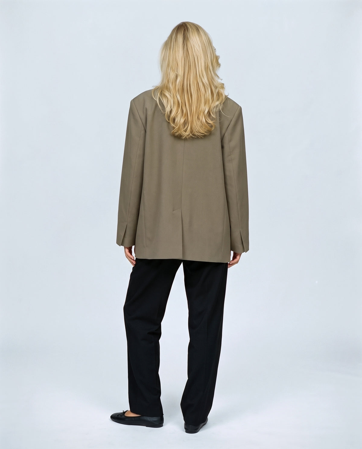 The Relaxed Double-Breasted Blazer in Khaki olive, back view on a non-pregnant model