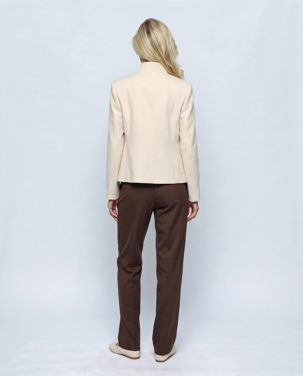 The Collarless Tailored Jacket in Beige, back view on a non-pregnant model
