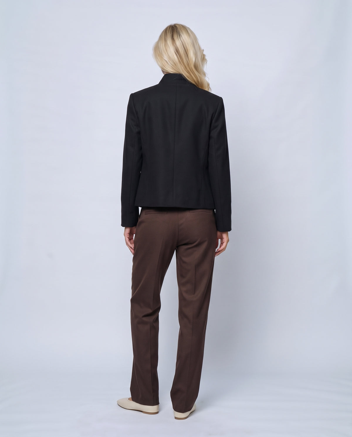 The Collarless Tailored Jacket in Black, back view on a non-pregnant model