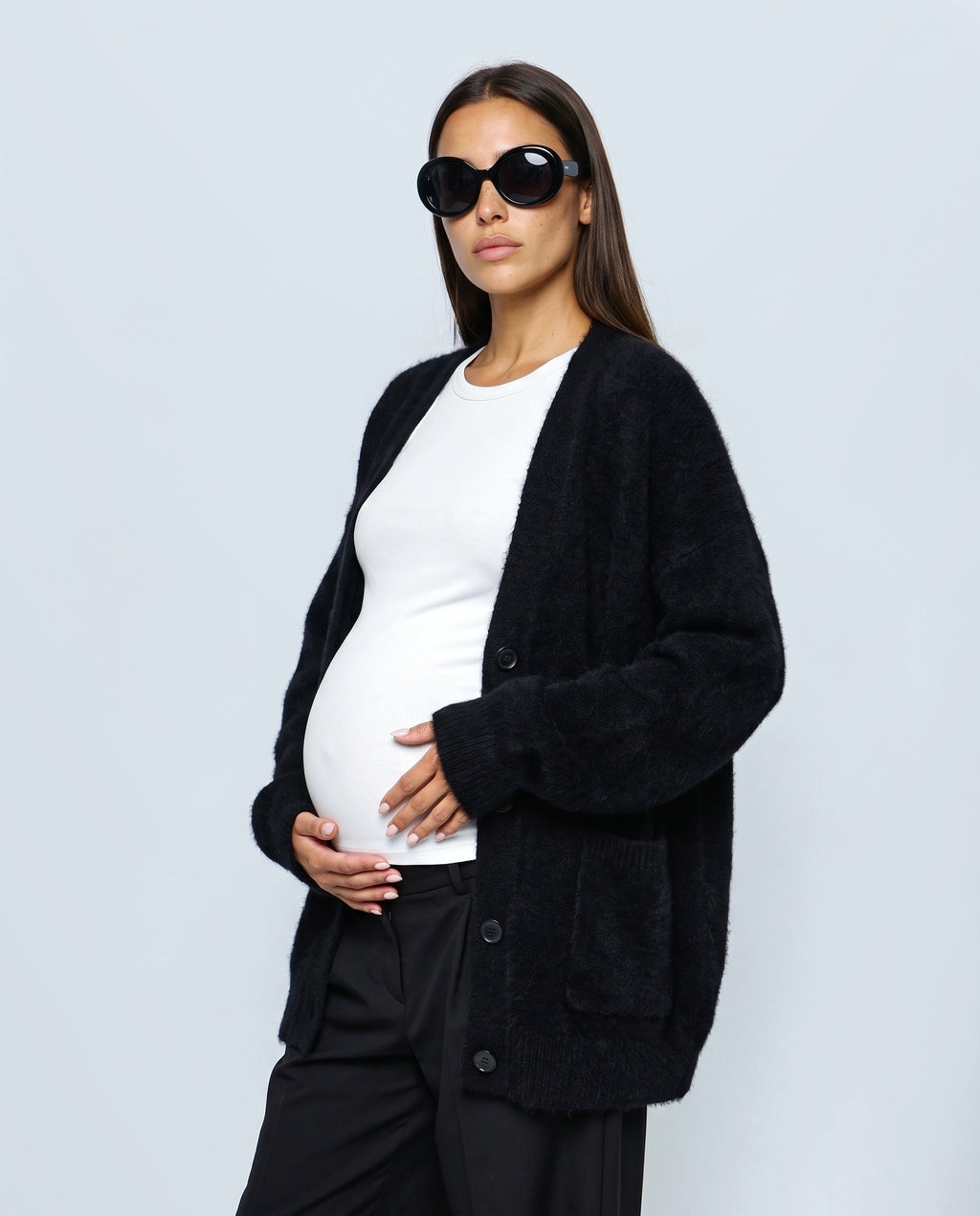 The Deep-V Cardigan in Black, side view