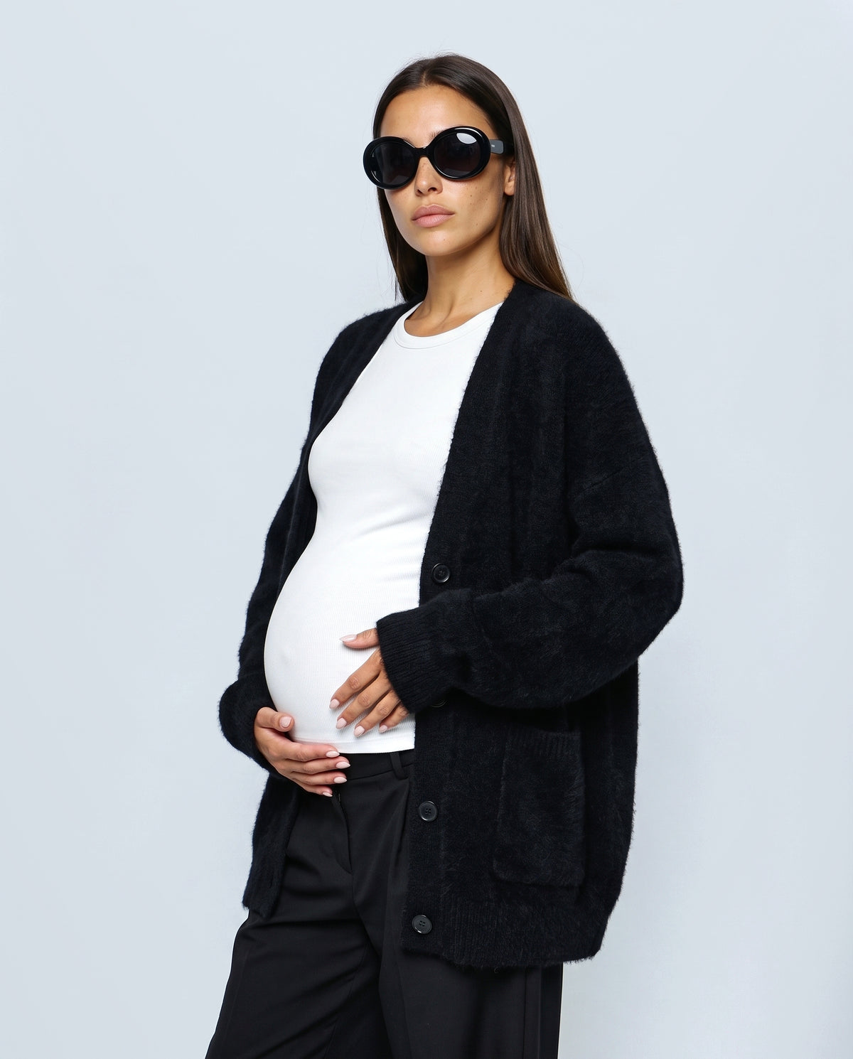 The Deep-V Cardigan in Black, side view
