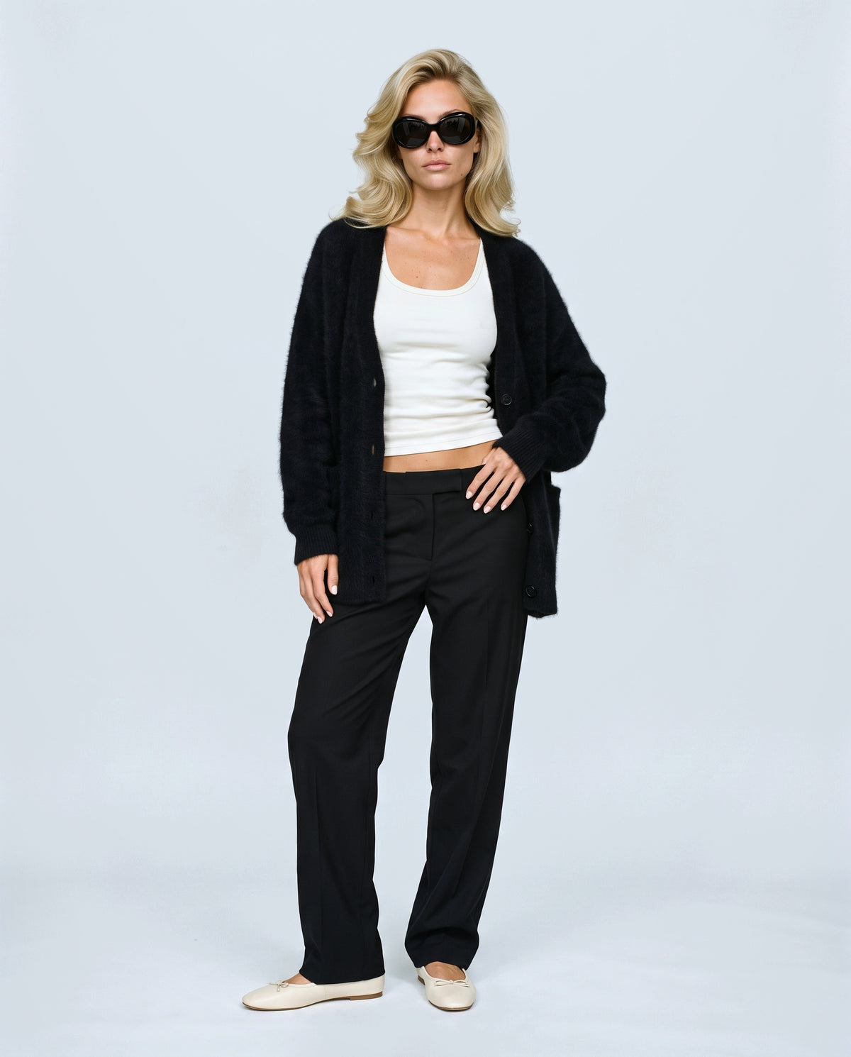 The Deep-V Cardigan in Black, front view on a non-pregnant model