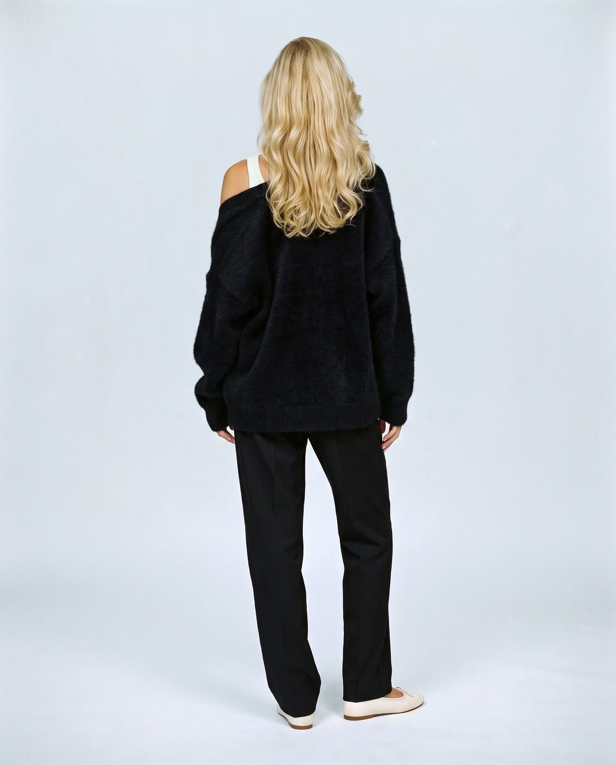 The Deep-V Cardigan in Black, back view on a non-pregnant model