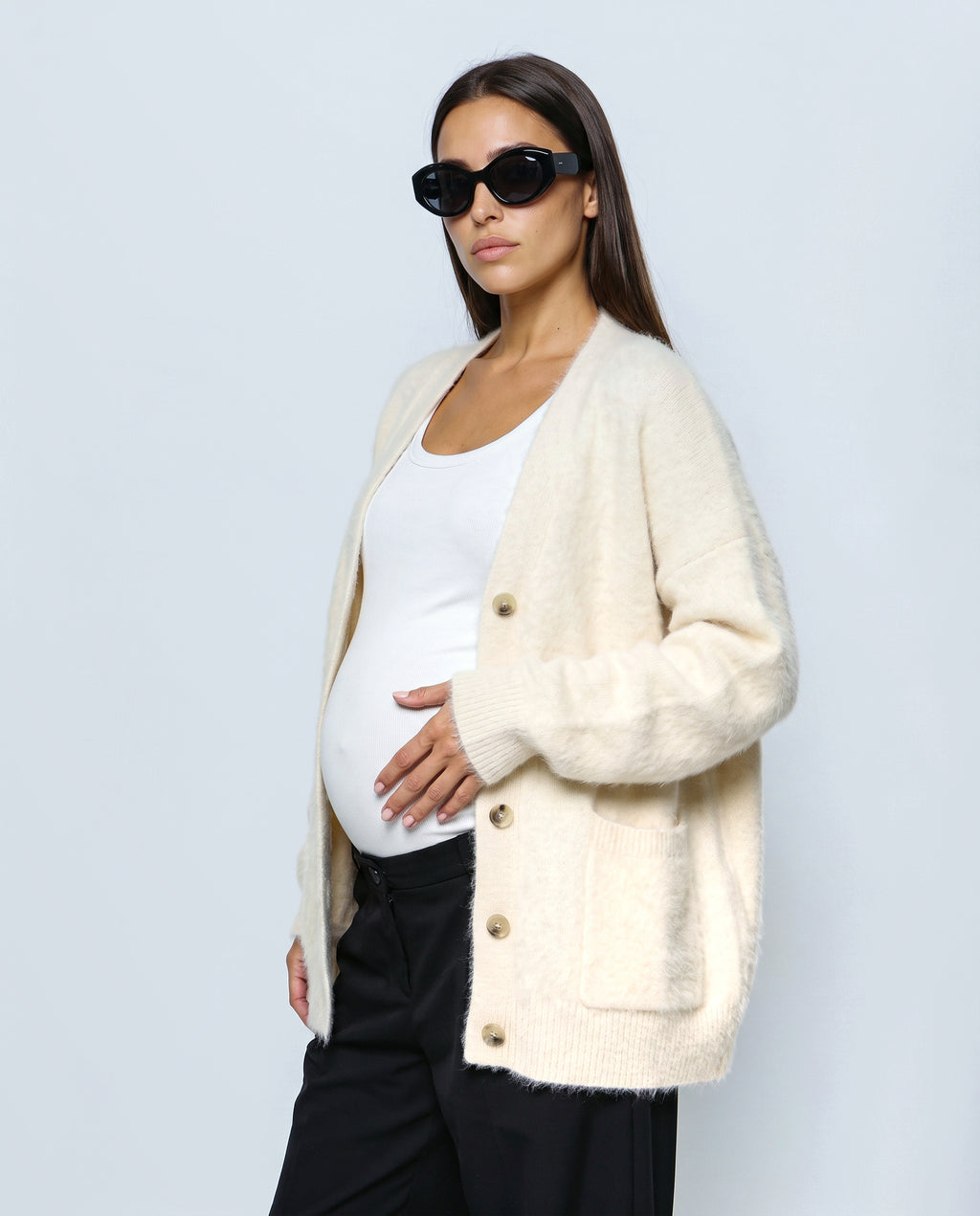 The Deep-V Cardigan in Cream, side view