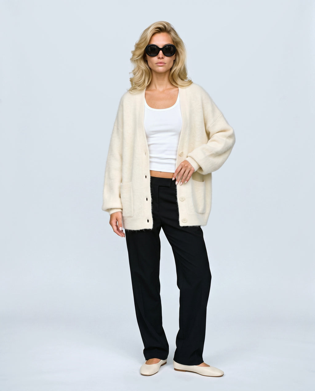 The Deep-V Cardigan in Cream, front view on a non-pregnant model