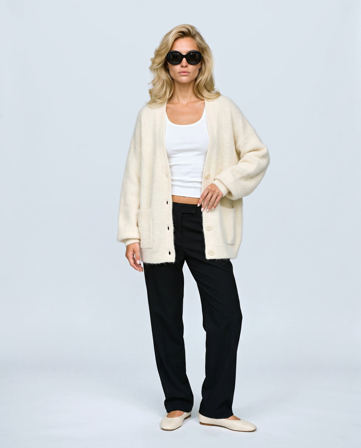 The Deep-V Cardigan in Cream, front view on a non-pregnant model