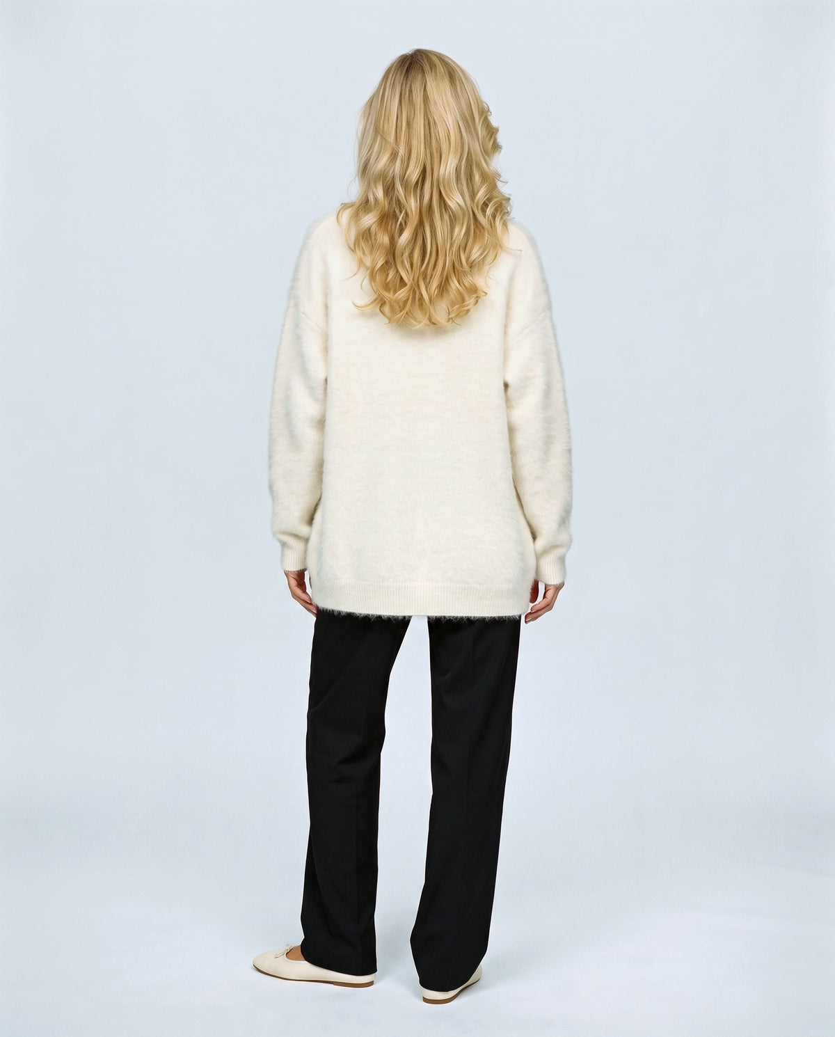 The Deep-V Cardigan in Cream, back view on a non-pregnant model