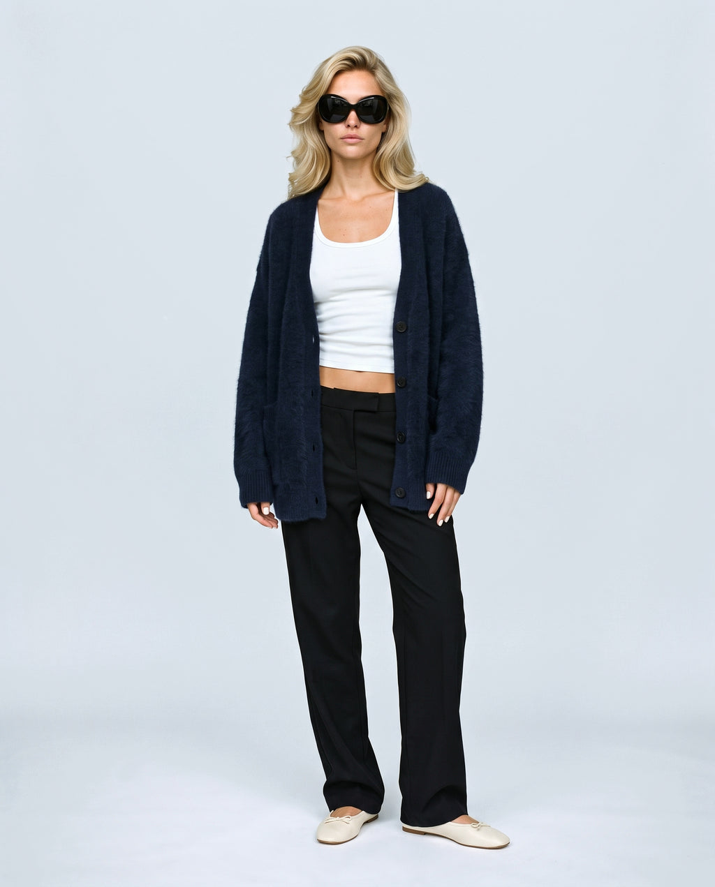The Deep-V Cardigan in Navy, front view on a non-pregnant model