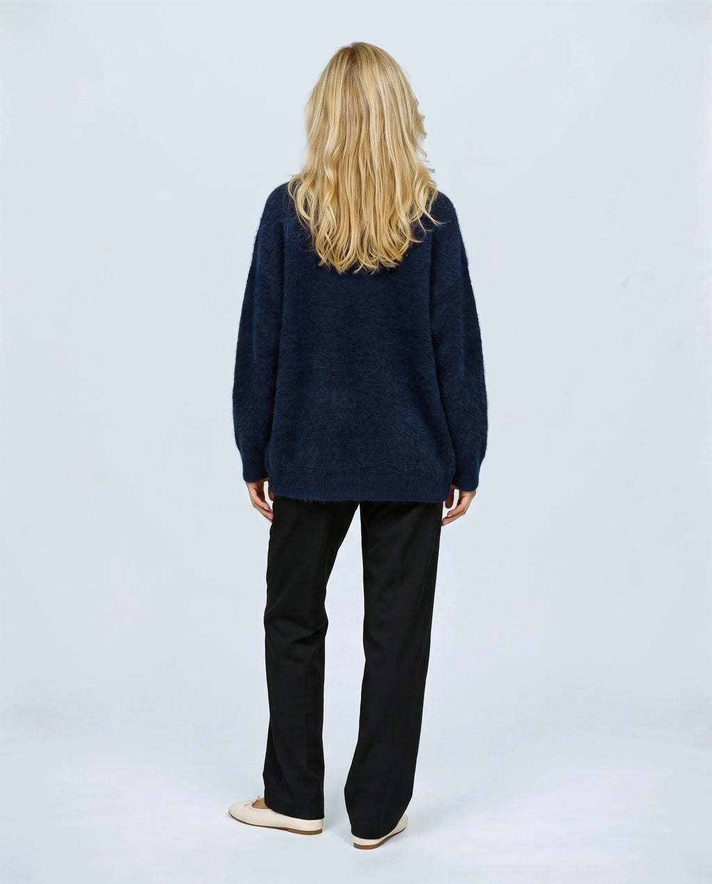 The Deep-V Cardigan in Navy, back view on a non-pregnant model
