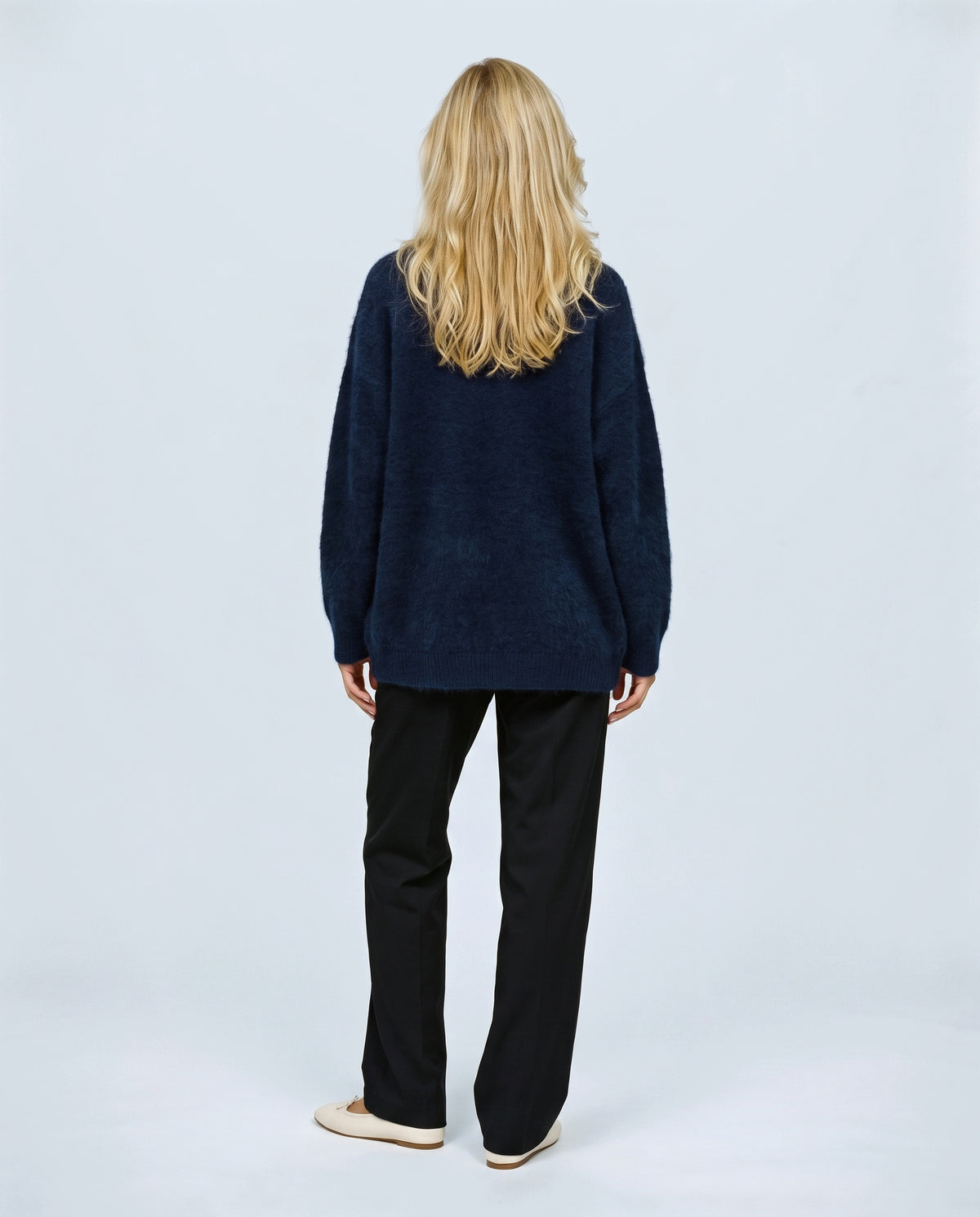 The Deep-V Cardigan in Navy, back view on a non-pregnant model