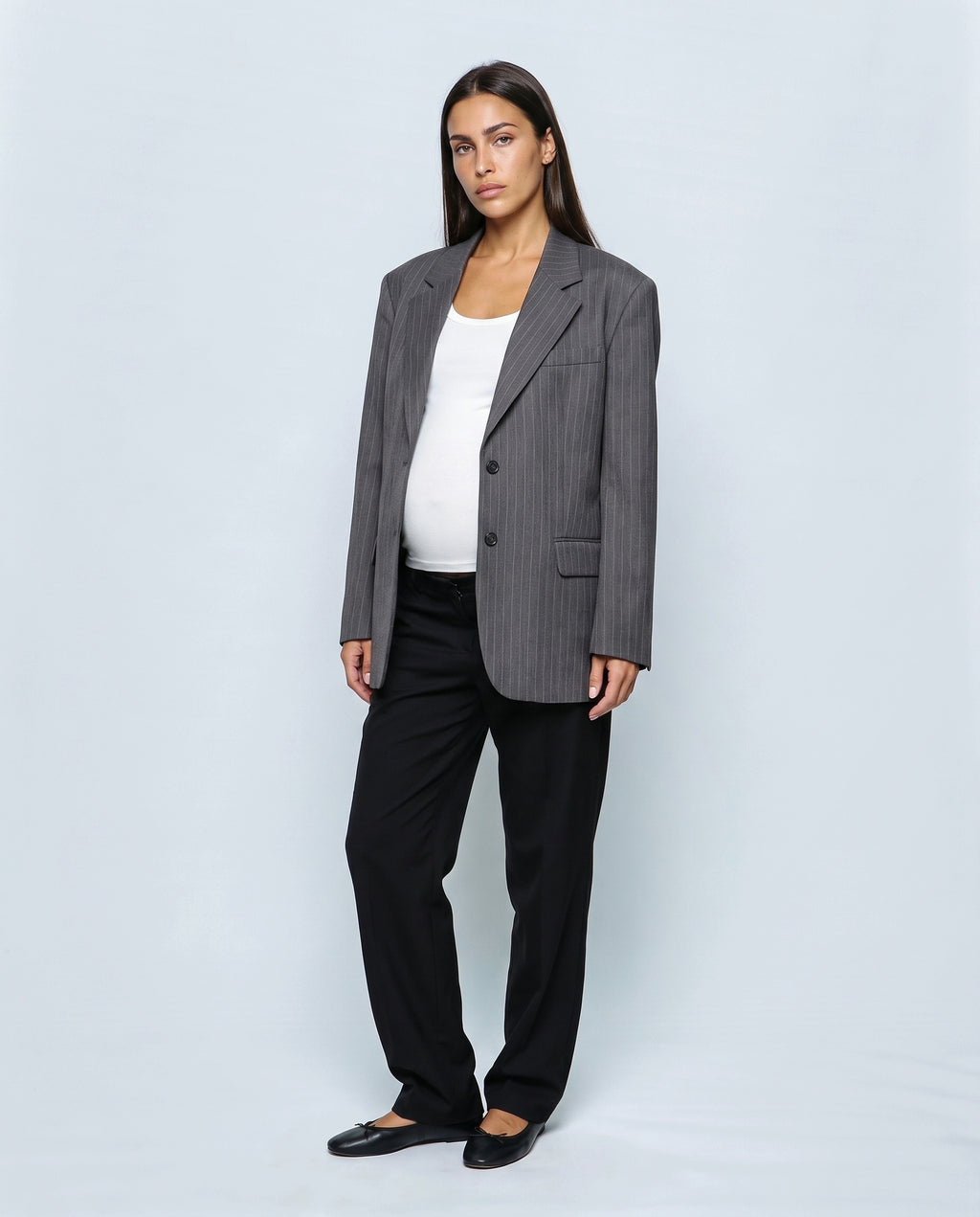 The Relaxed Pinstripe Blazer in Grey pinstripe, closed over the bump