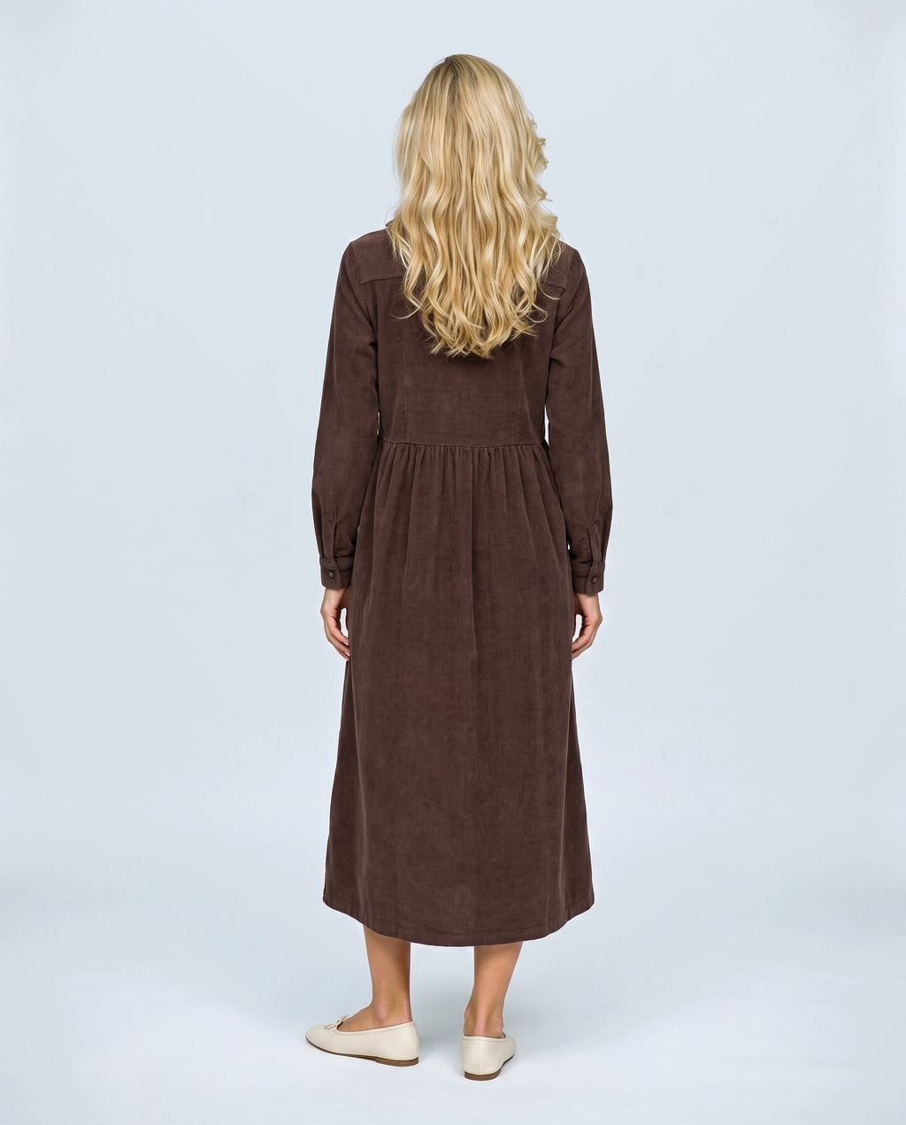 The Corduroy Shirt Dress in Brown, back view on a non-pregnant model