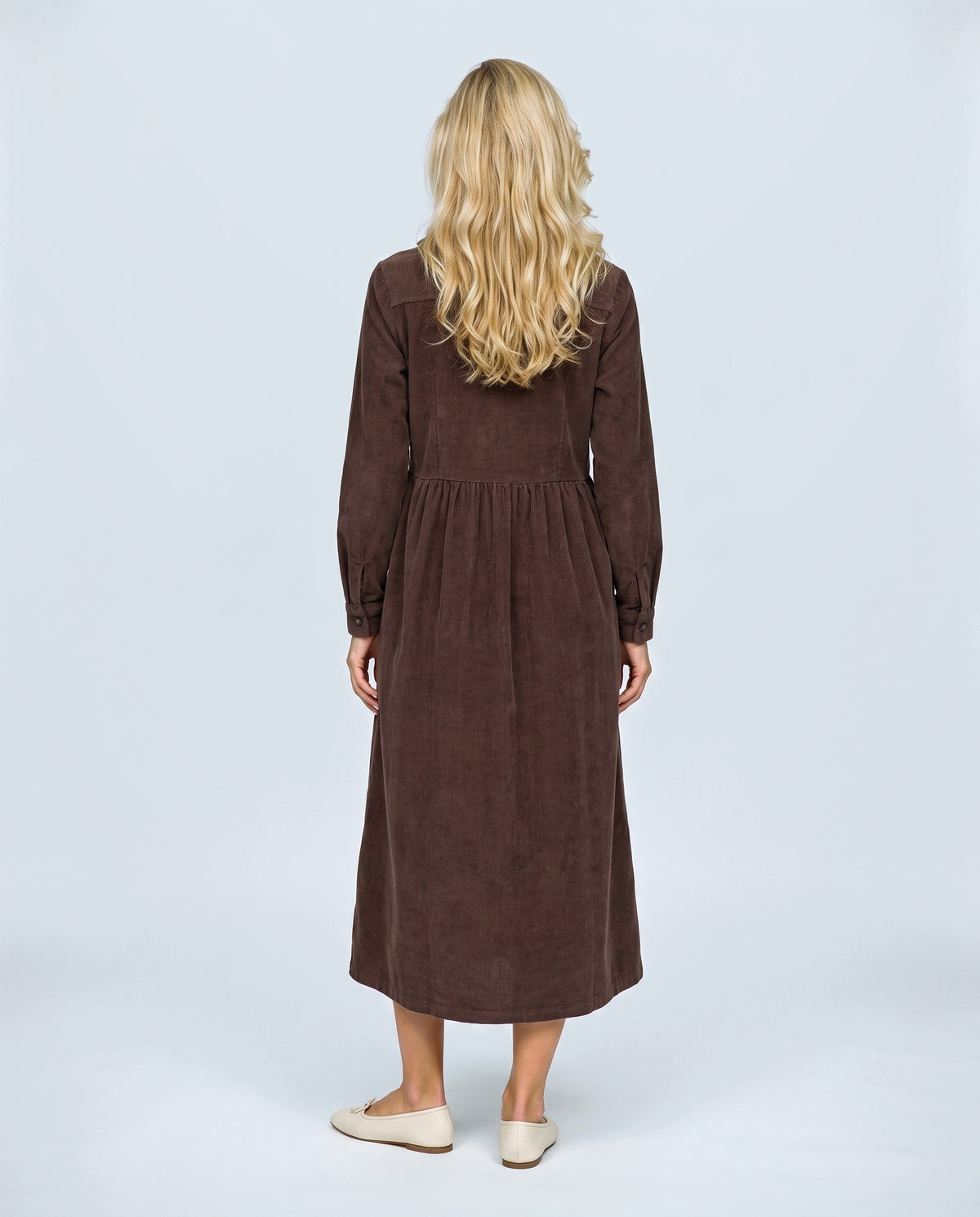 The Corduroy Shirt Dress in Brown, back view on a non-pregnant model