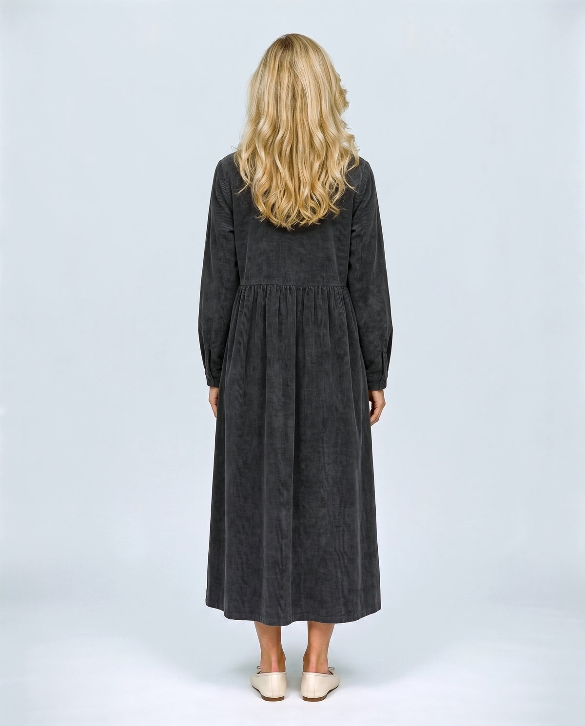 The Corduroy Shirt Dress in Charcoal, back view on a non-pregnant model