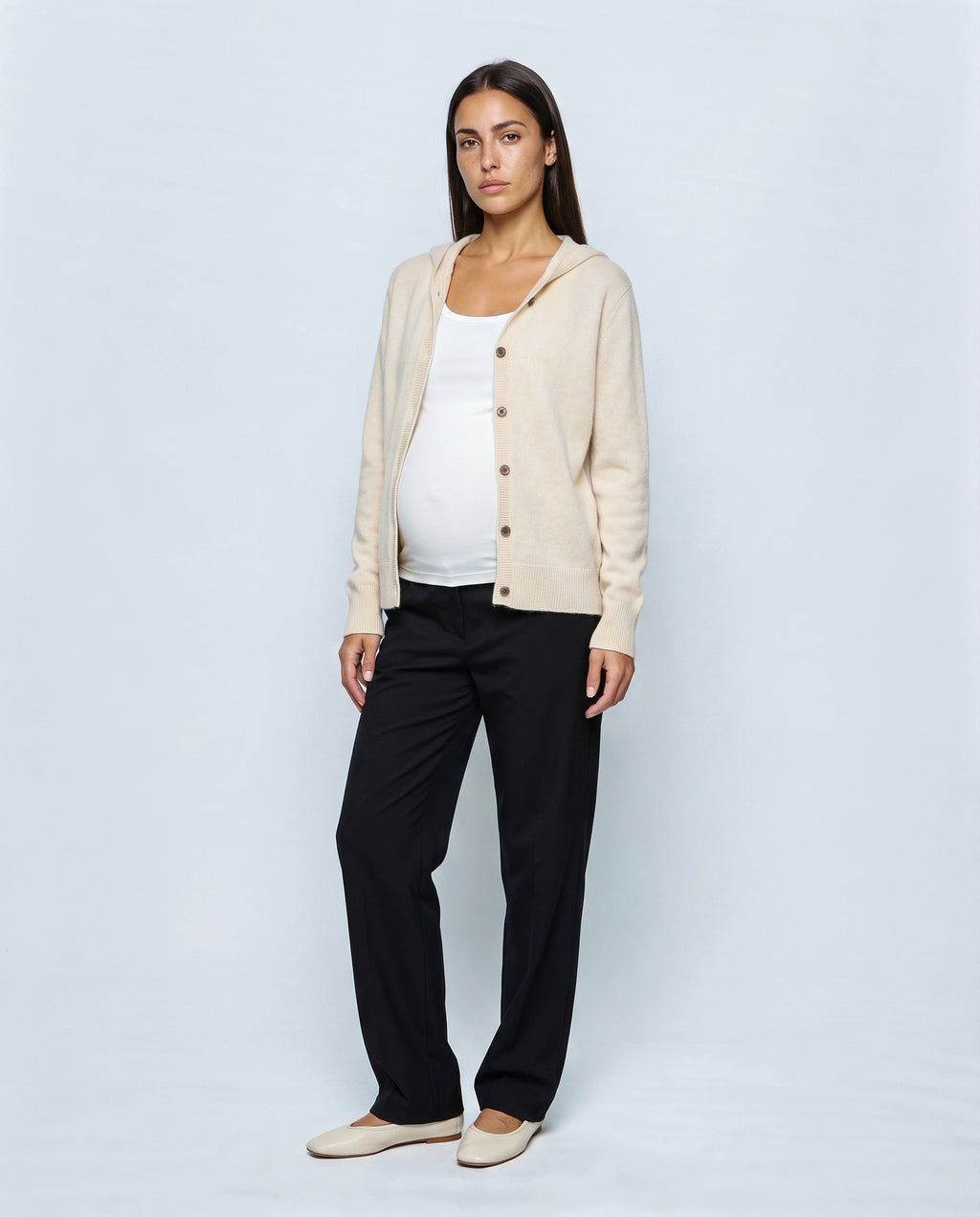 The Everyday Hooded Cardigan in Cream, closed over the bump