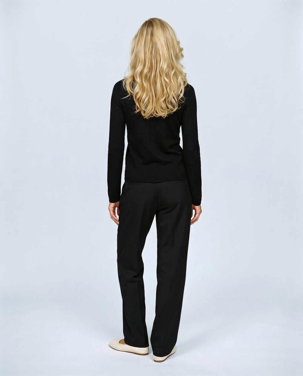 The Refined Crewneck Knit in Black, back view on a non-pregnant model