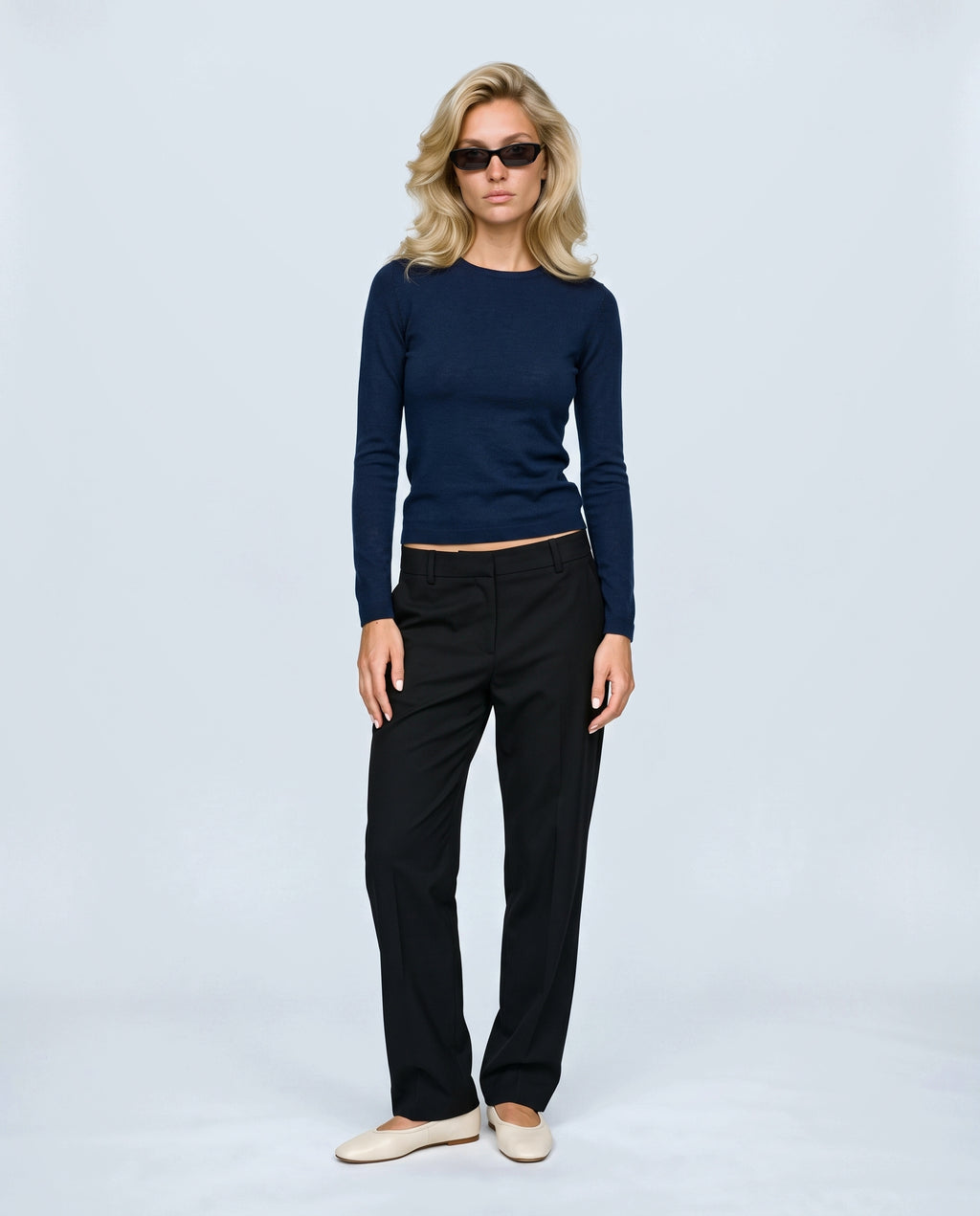 The Refined Crewneck Knit in Ink blue, front view on a non-pregnant model