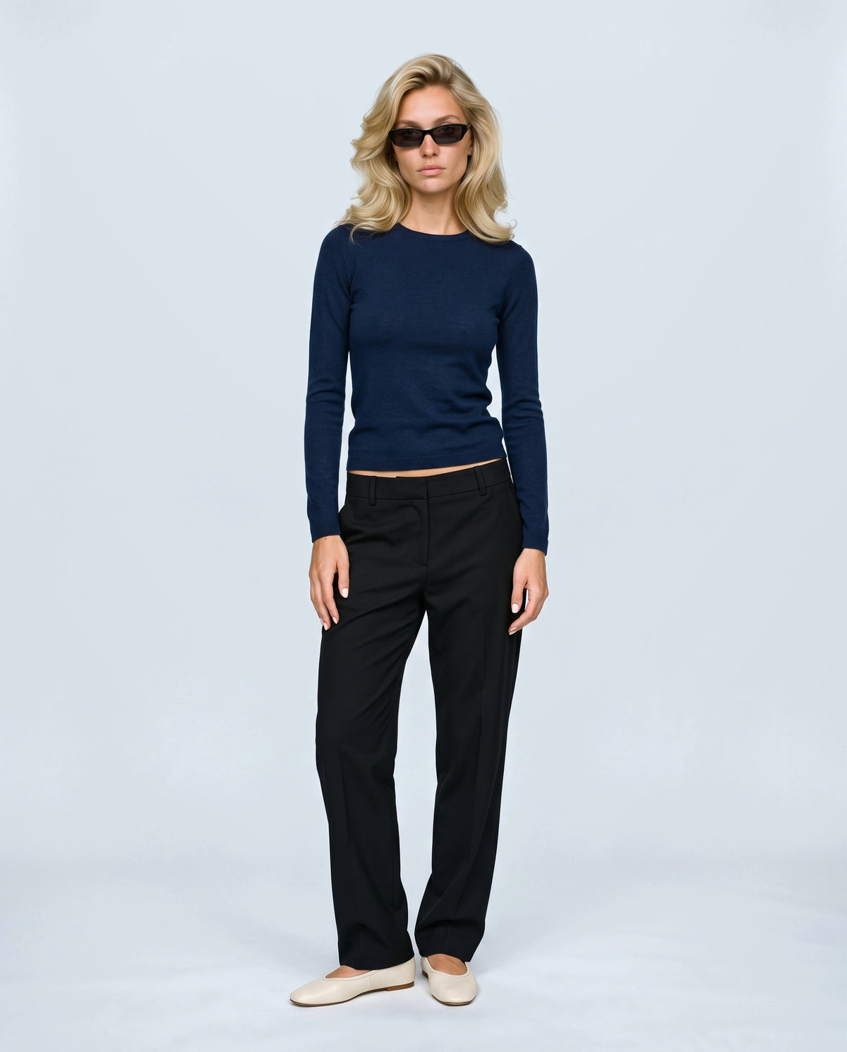 The Refined Crewneck Knit in Ink blue, front view on a non-pregnant model