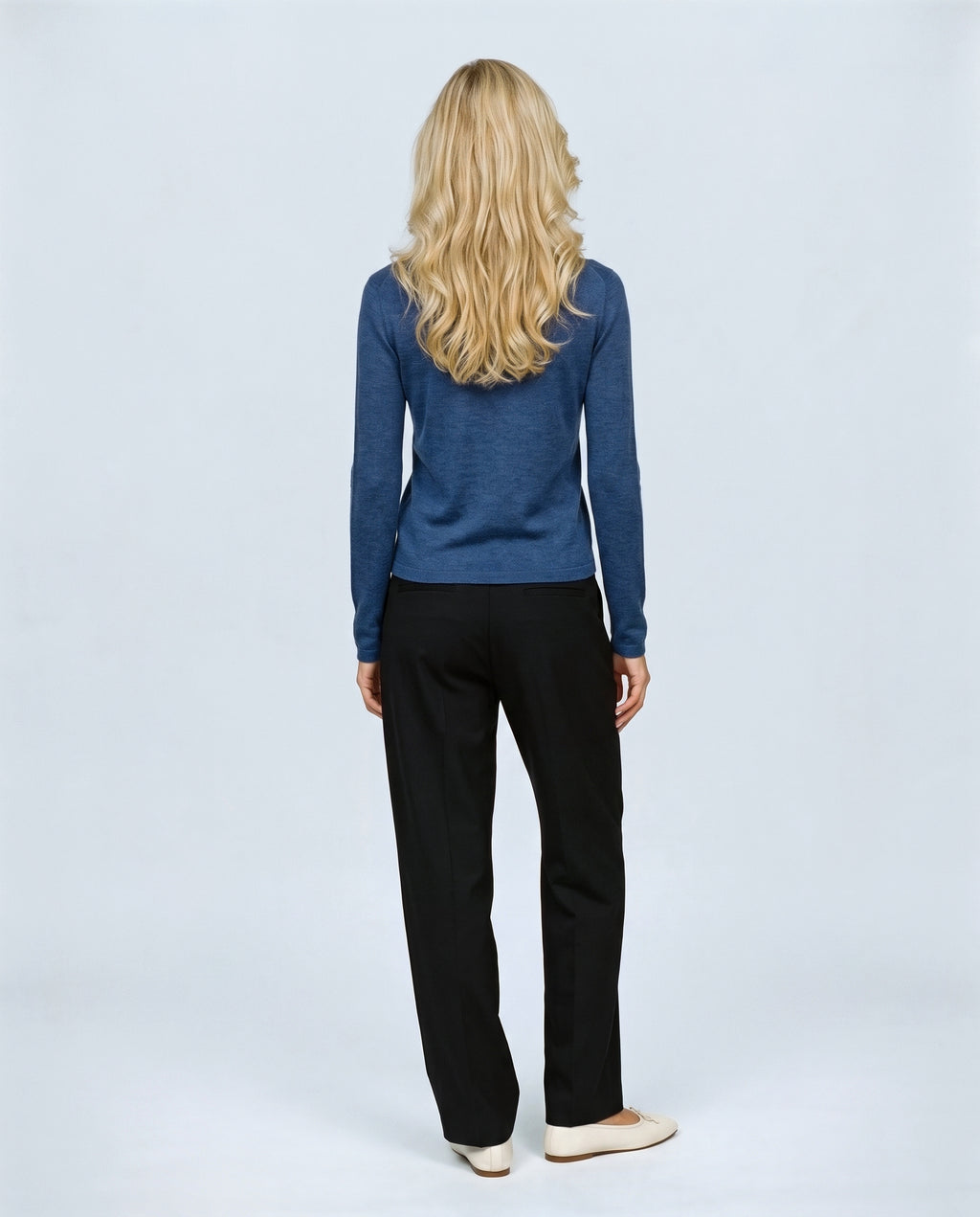 The Refined Crewneck Knit in Ink blue, back view on a non-pregnant model