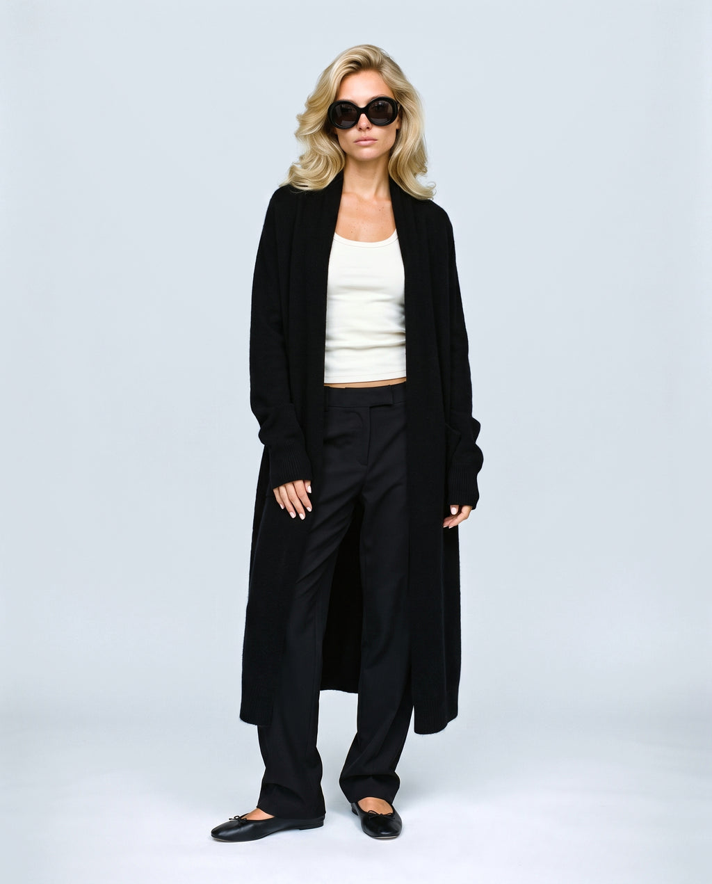 The Open-Front Longline Cardigan in Black, front view on a non-pregnant model