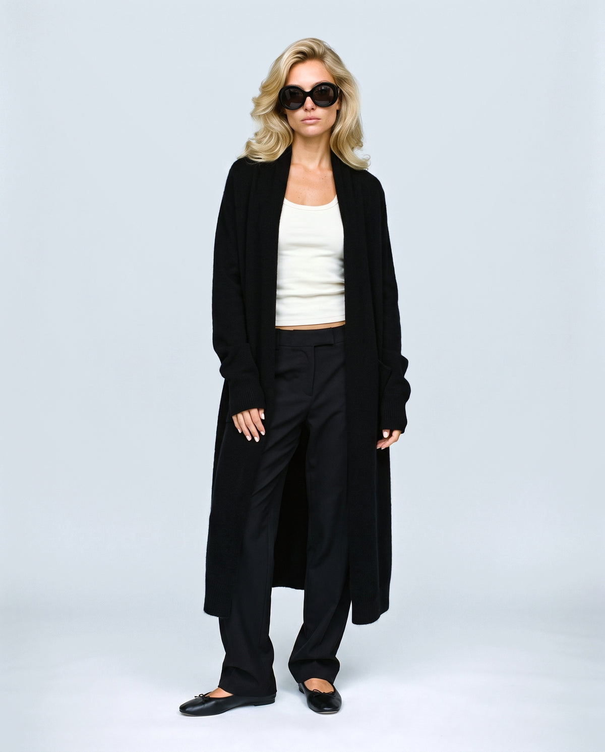The Open-Front Longline Cardigan in Black, front view on a non-pregnant model