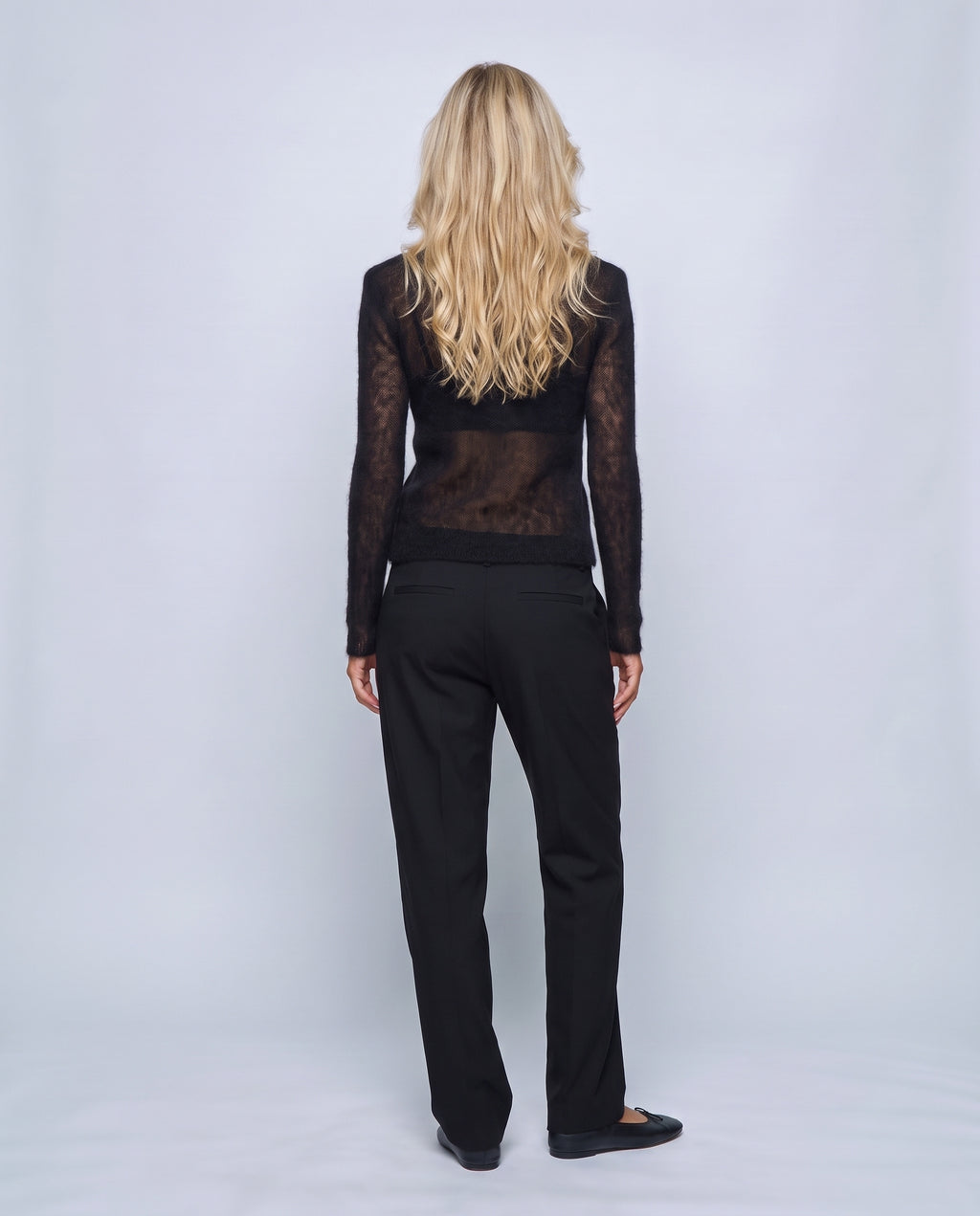 The Fine-Knit Crewneck in Black, back view on a non-pregnant model