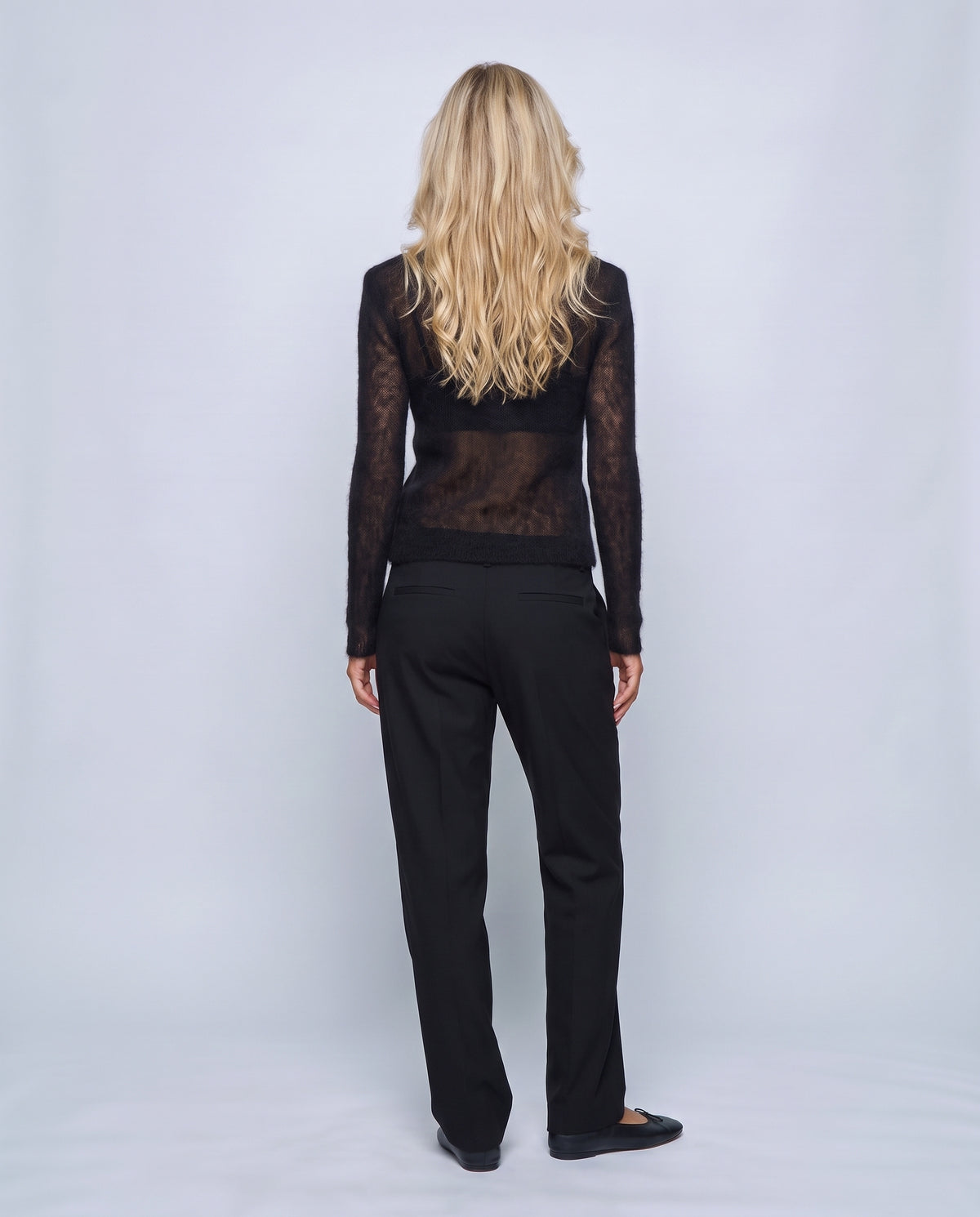 The Fine-Knit Crewneck in Black, back view on a non-pregnant model