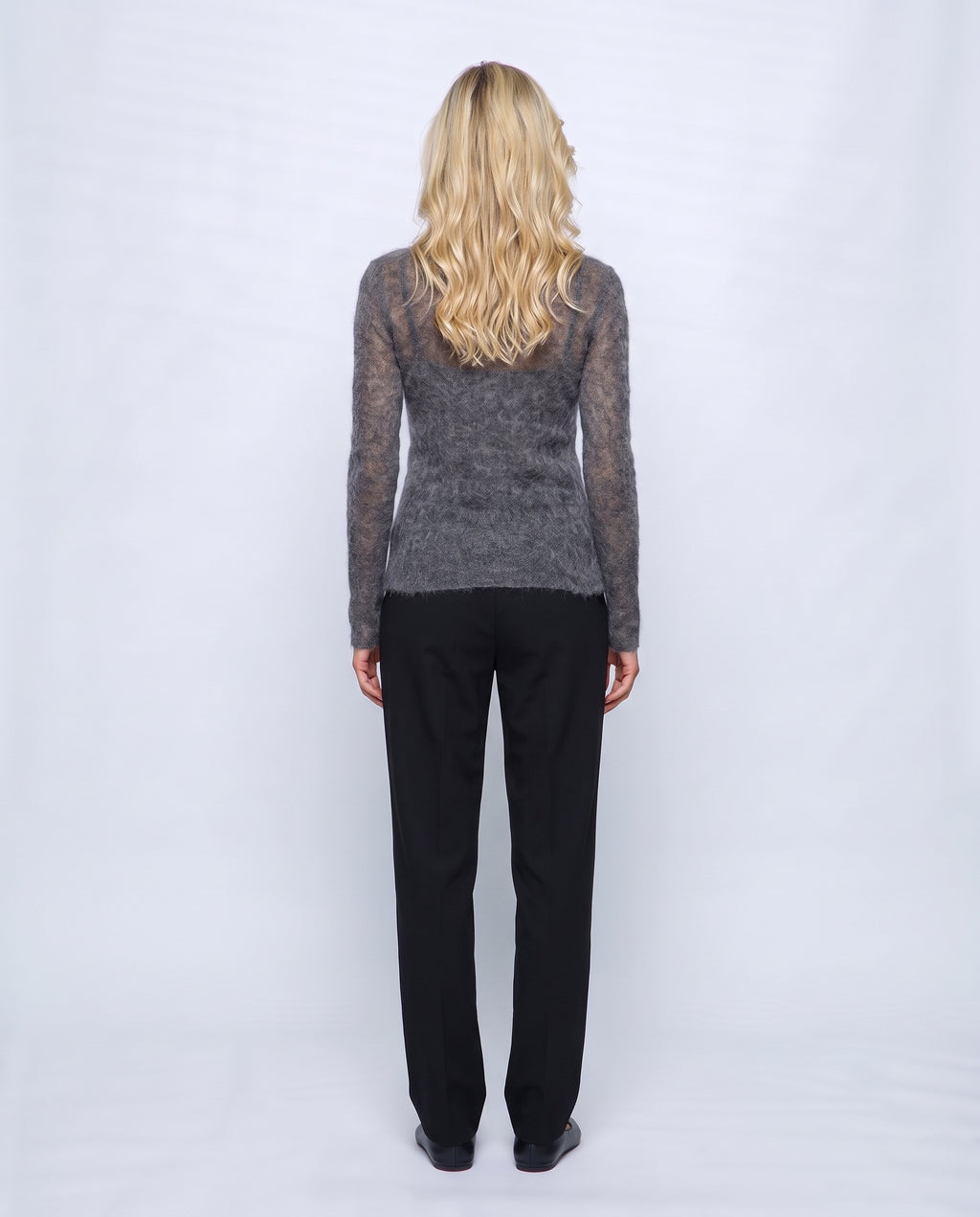 The Fine-Knit Crewneck in Charcoal grey, back view on a non-pregnant model