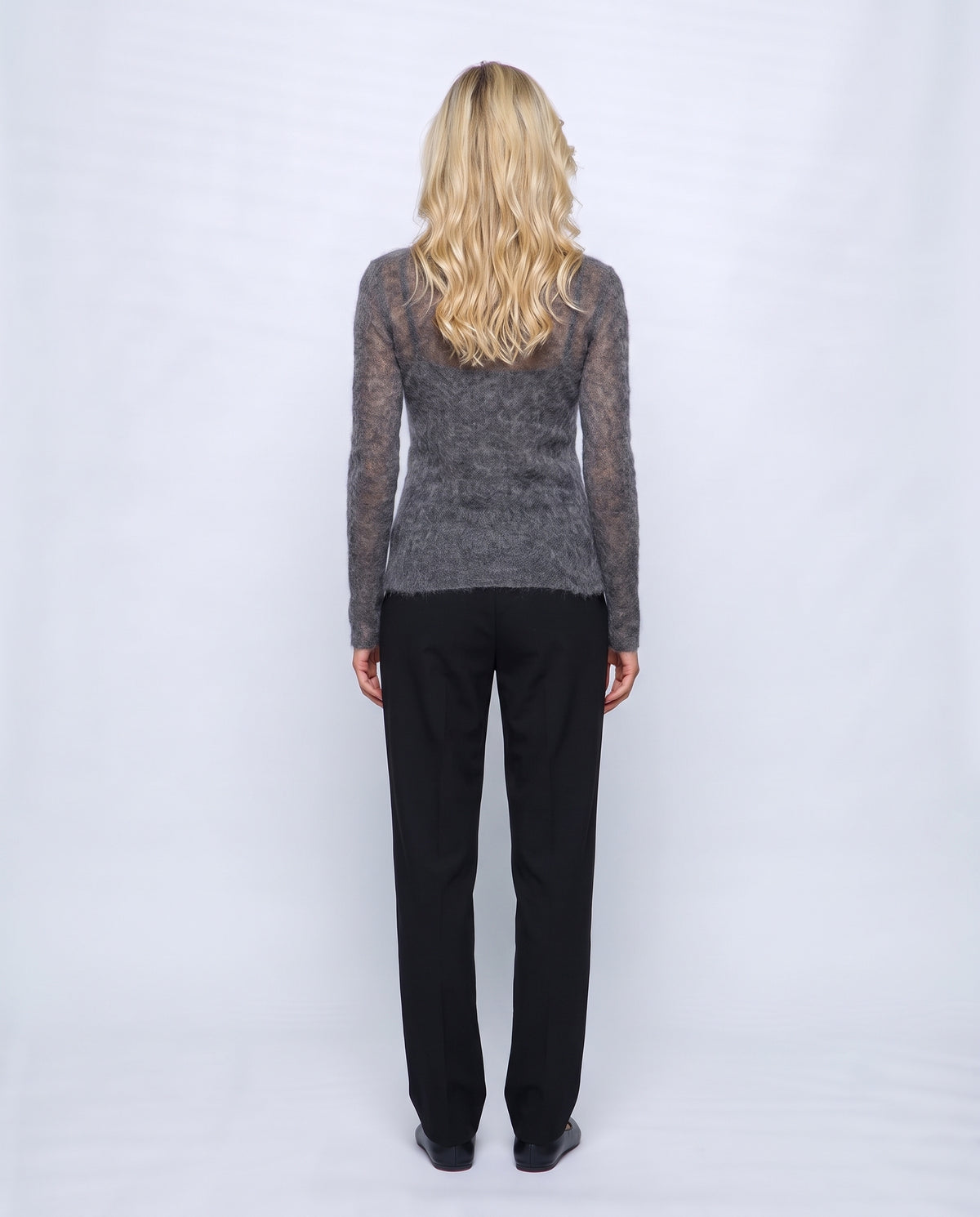 The Fine-Knit Crewneck in Charcoal grey, back view on a non-pregnant model