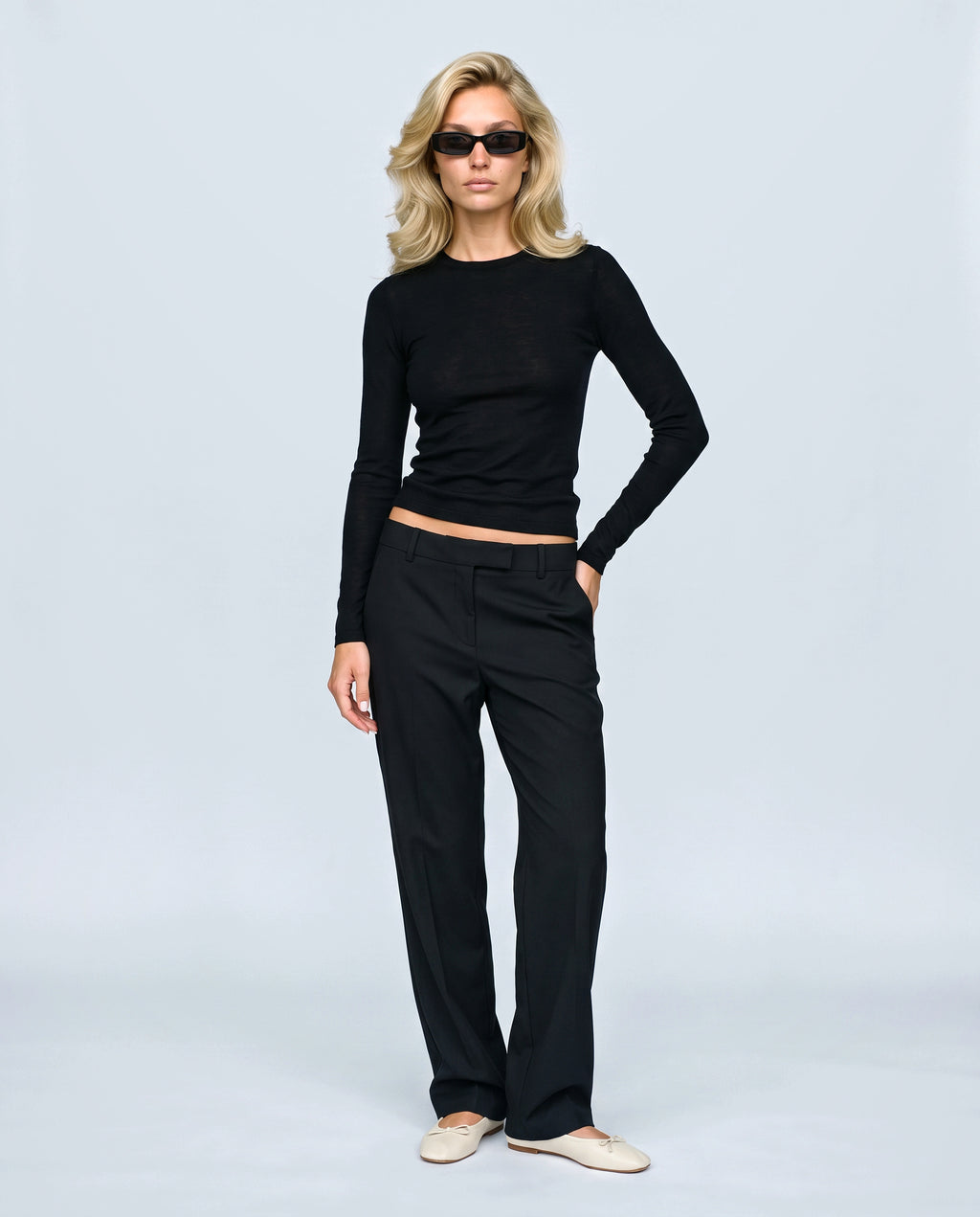 The Fine-Knit Layering Top in Black, front view on a non-pregnant model