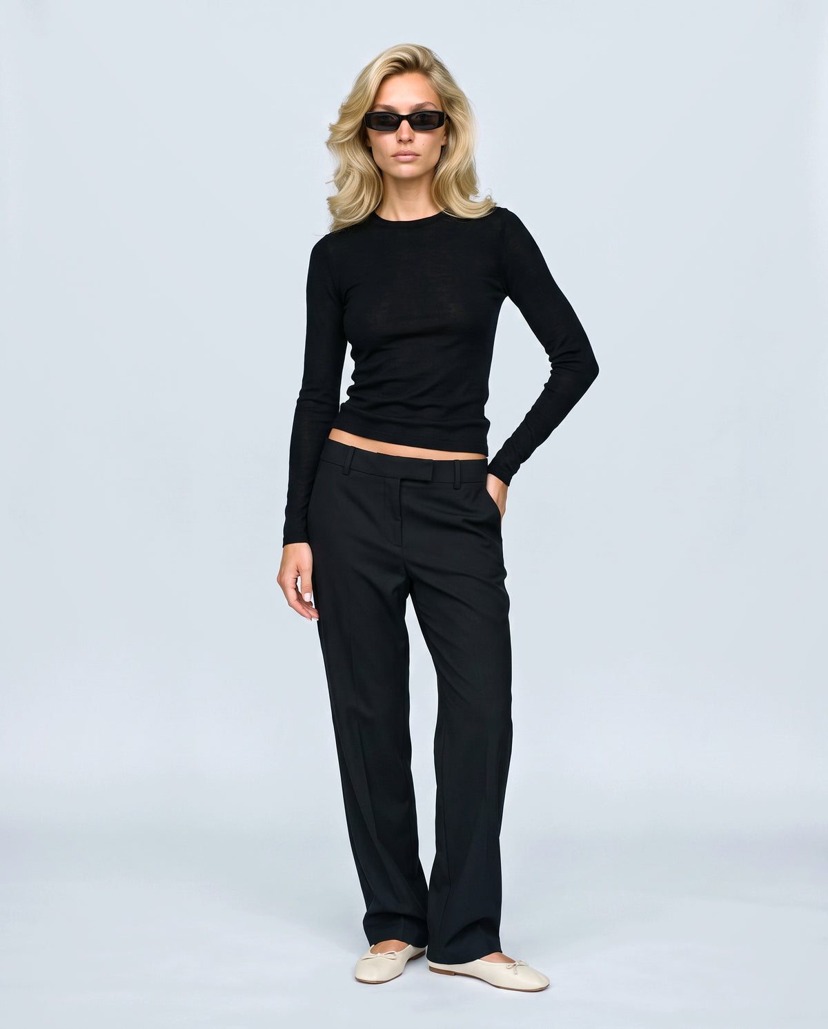 The Fine-Knit Layering Top in Black, front view on a non-pregnant model