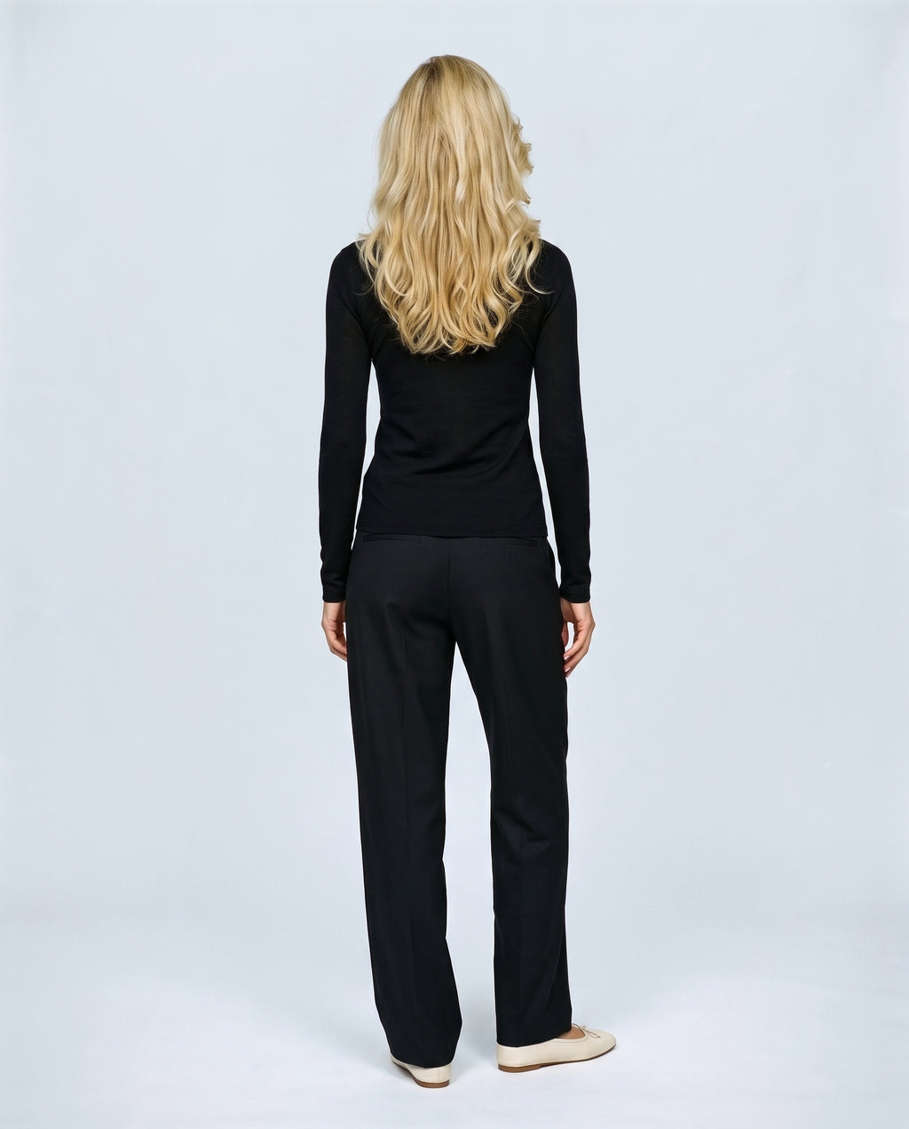 The Fine-Knit Layering Top in Black, back view on a non-pregnant model