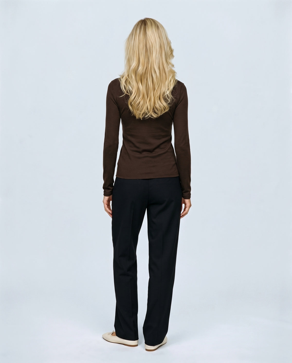 The Fine-Knit Layering Top in Ebony brown, back view on a non-pregnant model