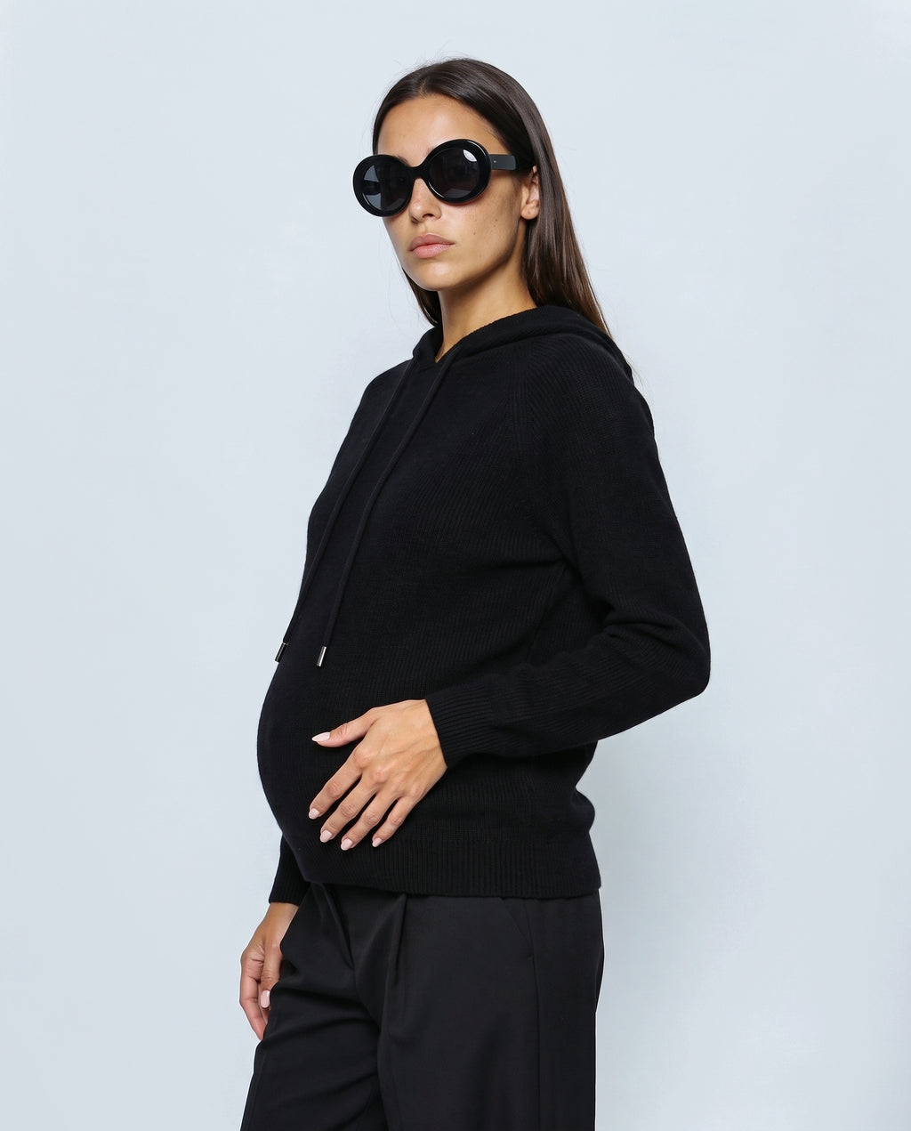 The Relaxed Knit Hoodie in Black, side view