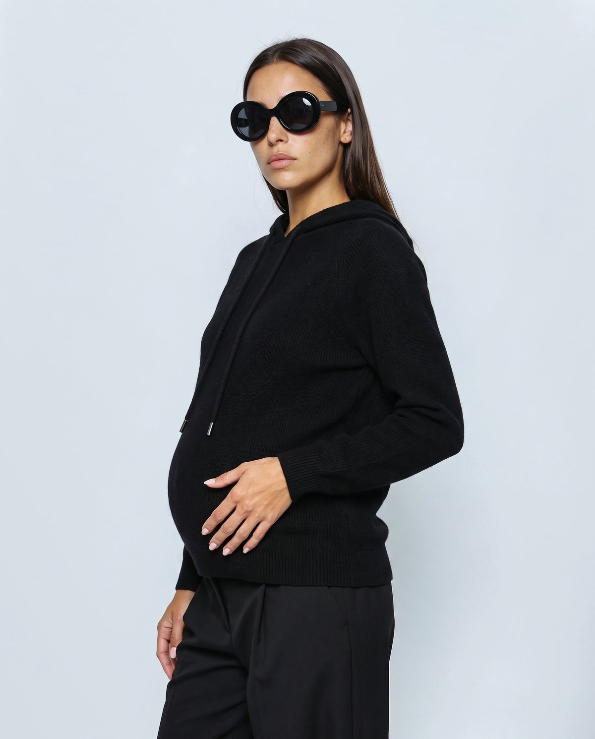 The Relaxed Knit Hoodie in Black, side view