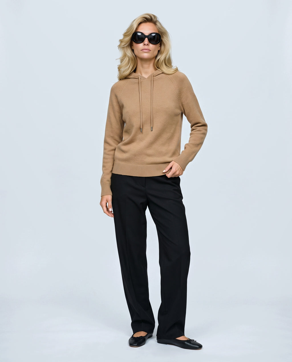 The Relaxed Knit Hoodie in Camel, front view on a non-pregnant model